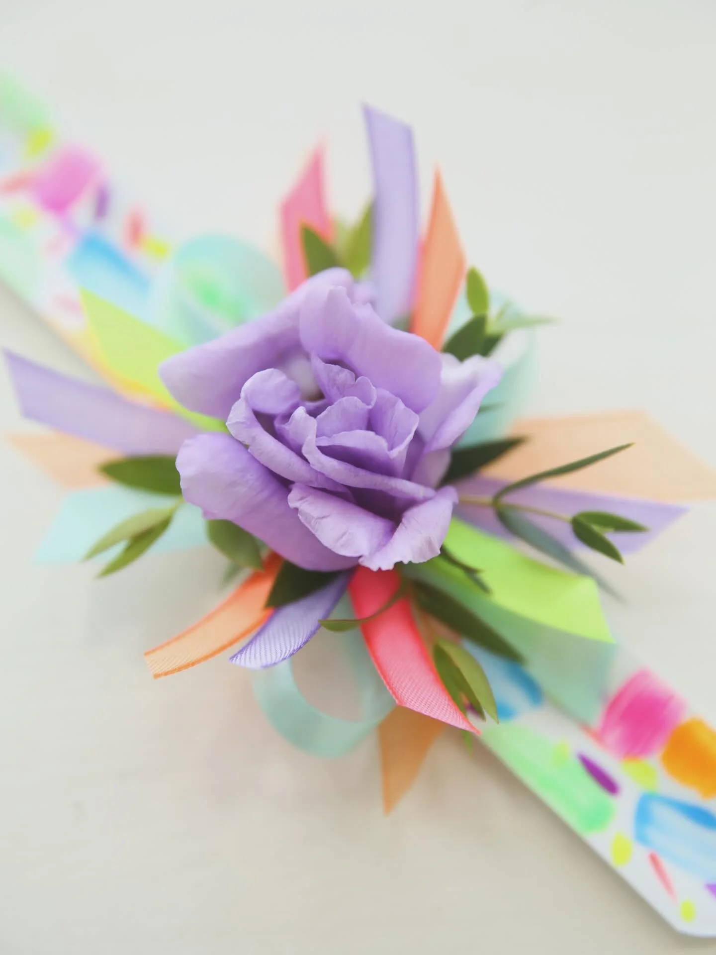 Light Up the Night Daddy/Daughter Dance Corsage! 🪩

They are here for this iconic Cedarville event and oh so fun!

A white slap band featuring a neon and glow in the dark hand painted design topped with an array of eye catching ribbon. Just choose y