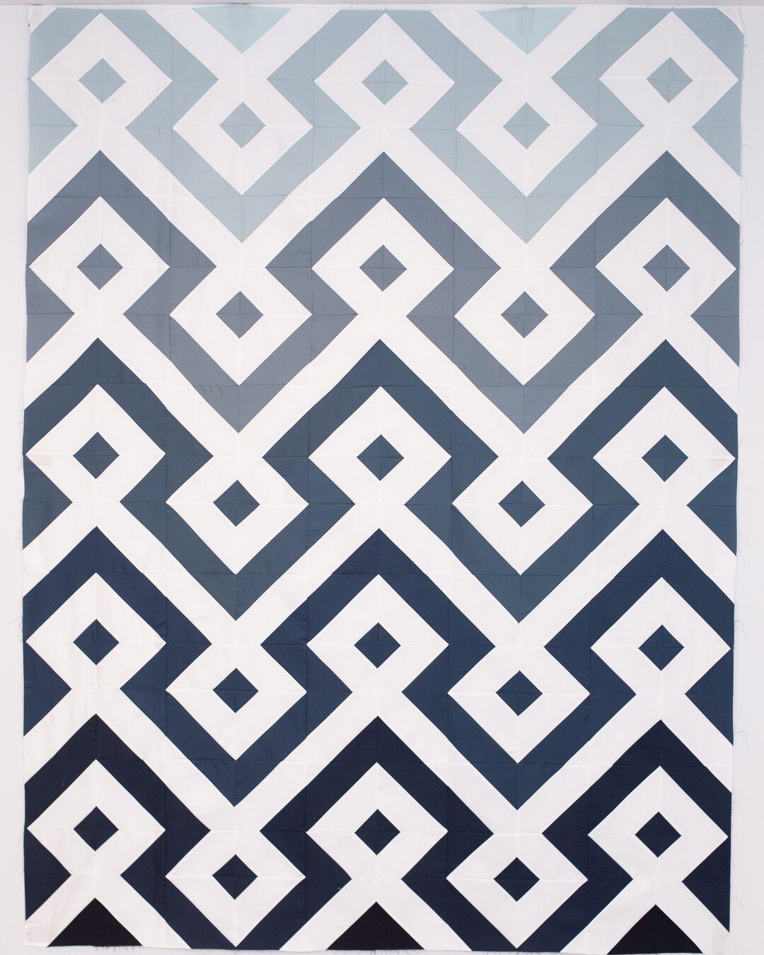 The photo really doesn&rsquo;t do it justice but I&rsquo;m so excited for how this has turned out. @monogramformakers pulled these blues for me nearly a year ago and it&rsquo;s so fun to finally see it all come together. Now off to the quilters.⠀⠀⠀⠀⠀
