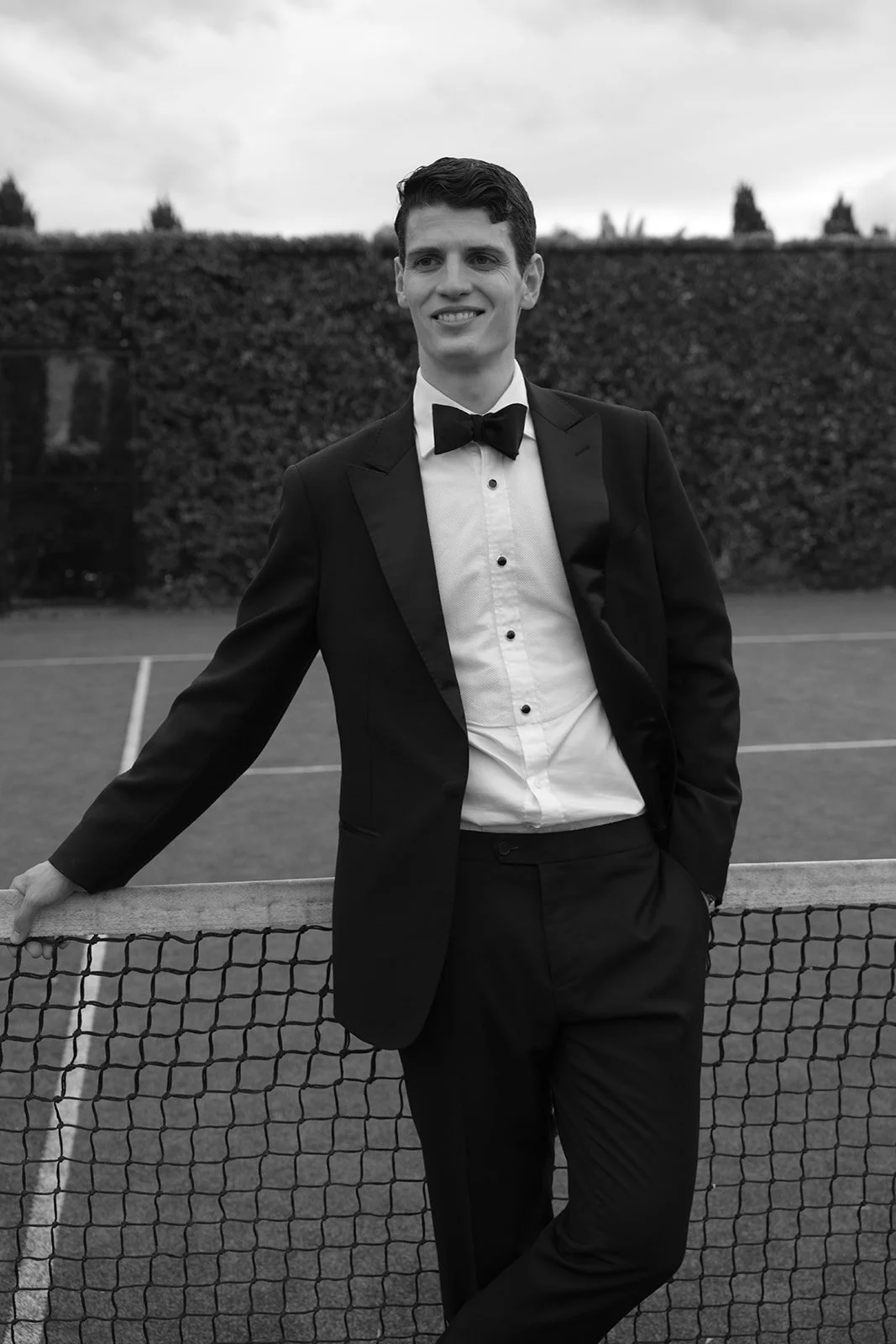 A quiet portrait of the groom on the tennis court at Krinklewood Estate in Broke, Hunter Valley.