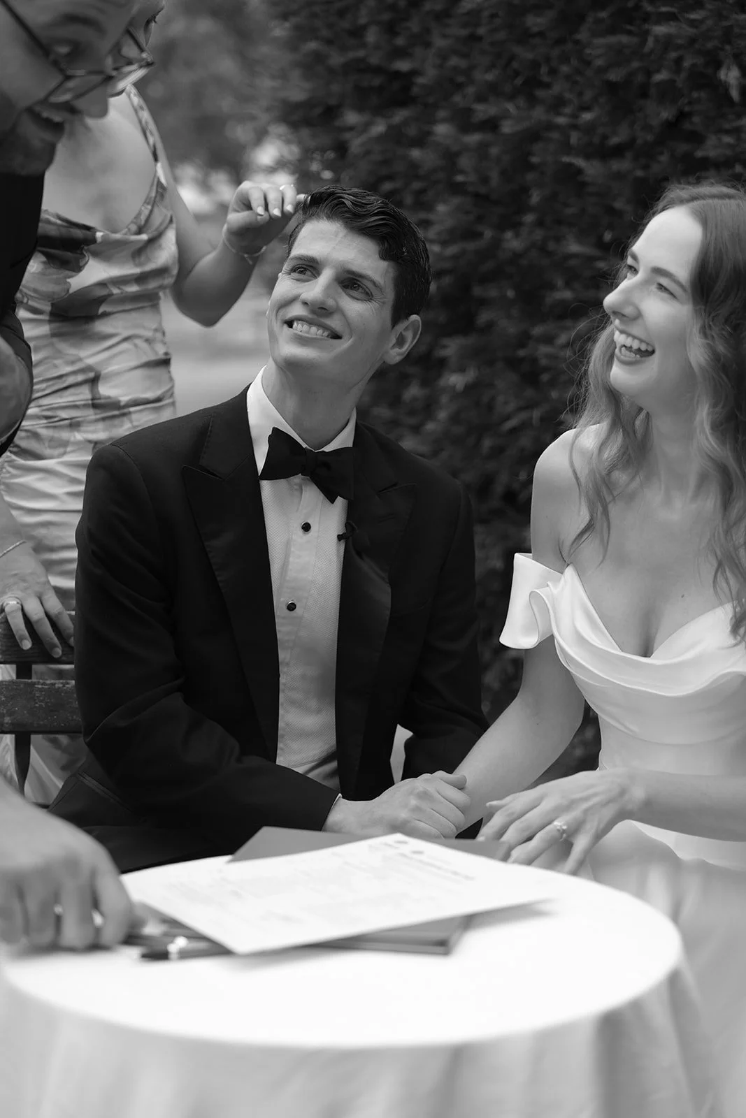 The couple signing the marriage registry during their ceremony at Krinklewood Estate in the Hunter Valley.