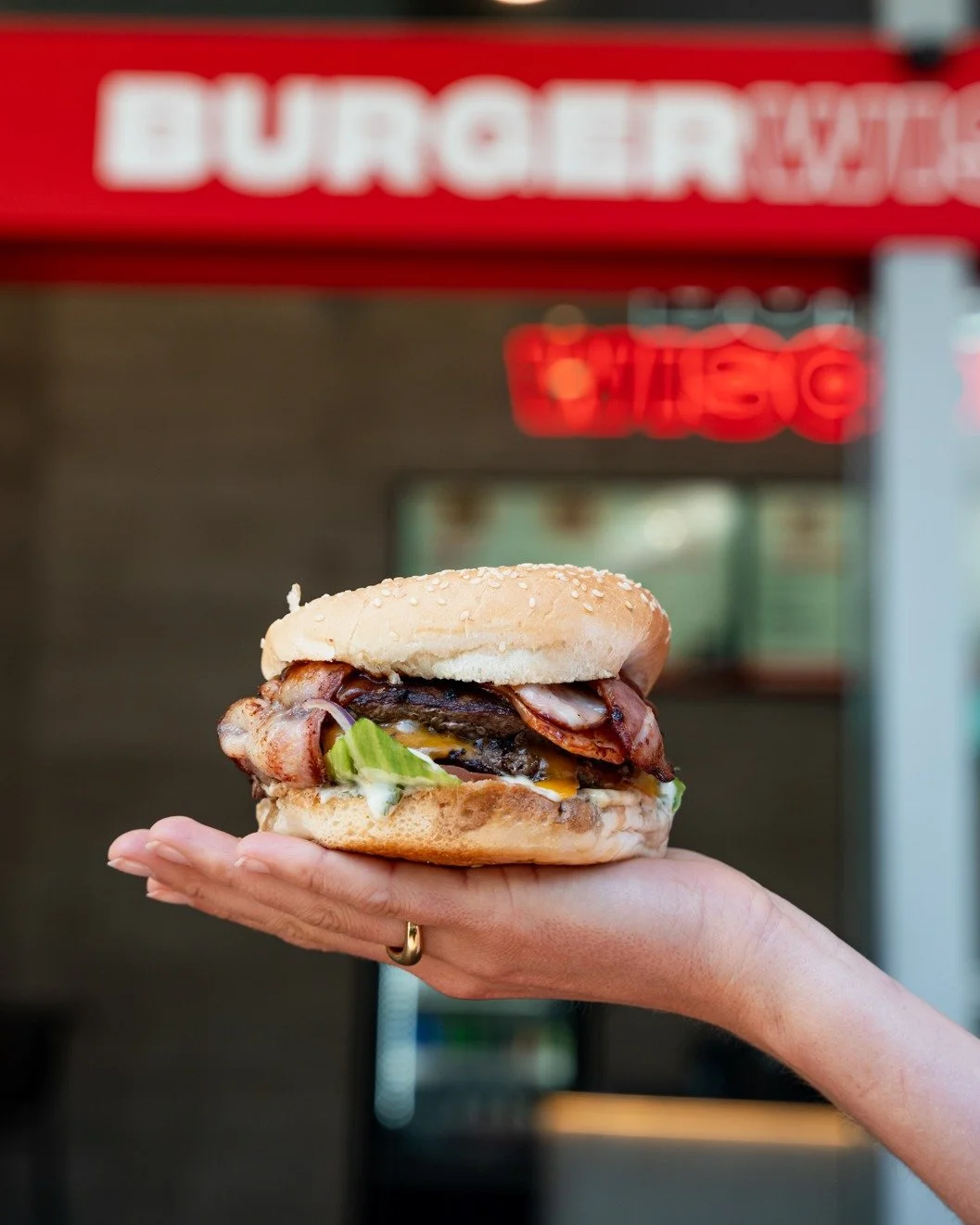 GET STUCK IN to the legendary Full Monty: Two big beef patties, bacon, cheddar, garlic mayo, salad, and relish on a sesame seed bun. 💥