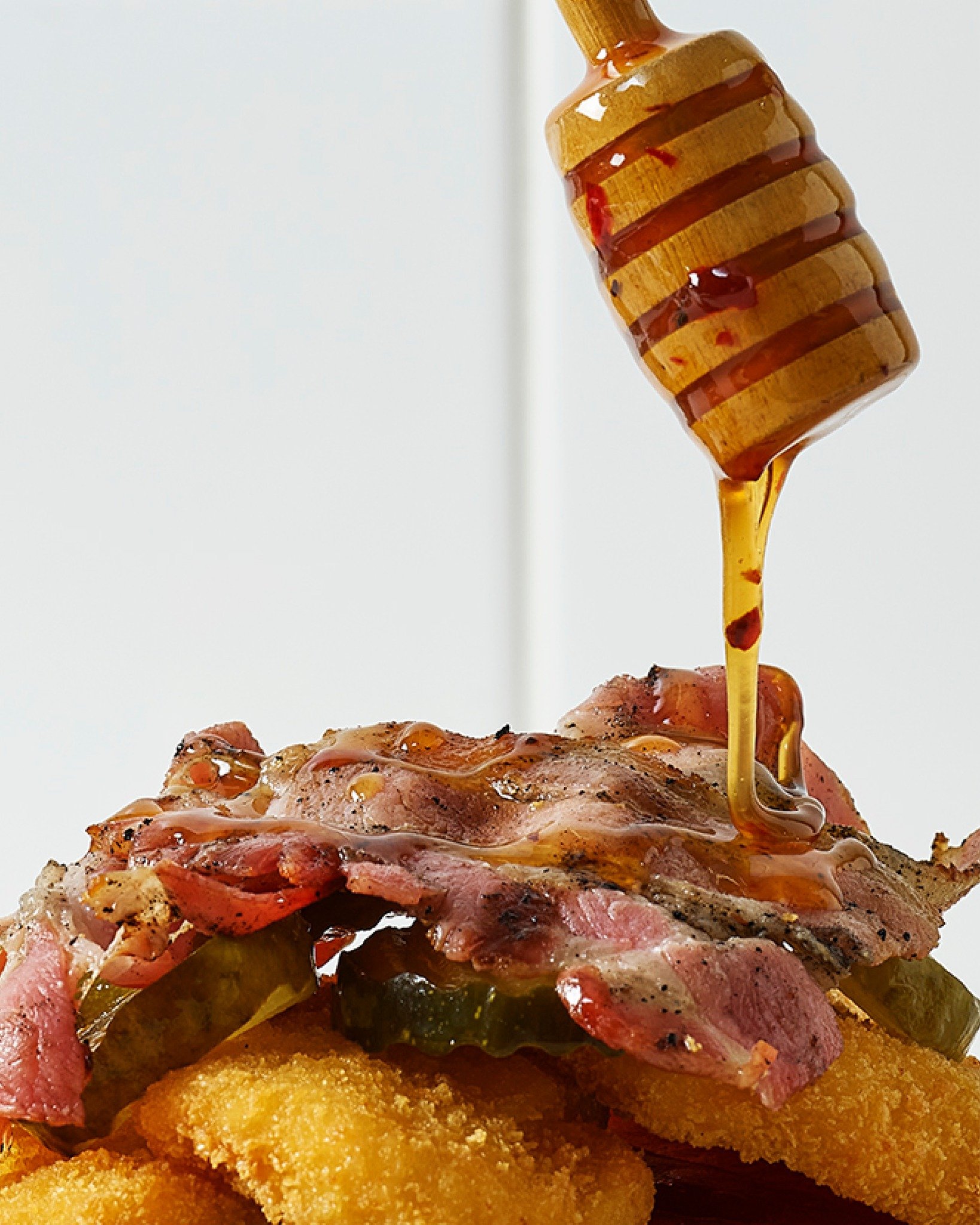 For those who like a little heat with their treat. Burger Wisconsin take on the hot honey burg - in your hot little hands from 17.01.26. 🍯