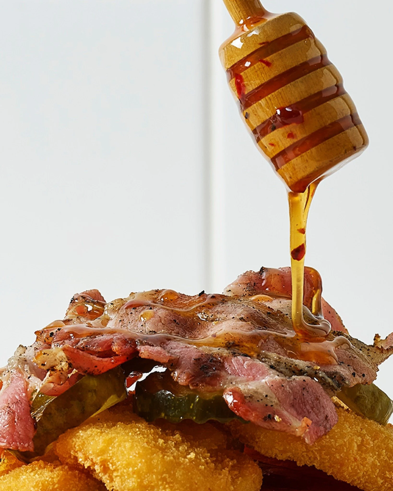 For those who like a little heat with their treat. Burger Wisconsin take on the hot honey burg - in your hot little hands from 17.01.26. 🍯