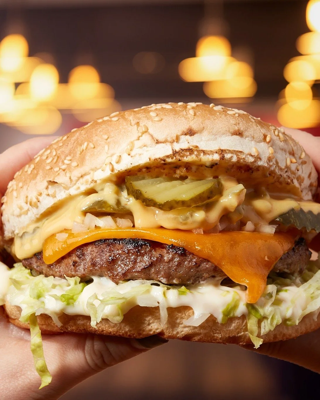 The Beef Boss. Beef patty, our secret boss sauce, double cheddar, diced onion, kosher dill pickles, mayo, and shredded lettuce on a sesame seed bun. 👌