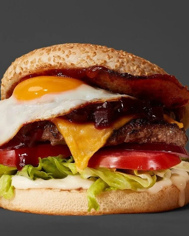 Chur bro, that's a sweet as burger. The Kiwi Burger: Beef patty, bacon, egg, cheddar, beetroot relish, mayo, salad, and relish on a sesame seed bun. 🍔