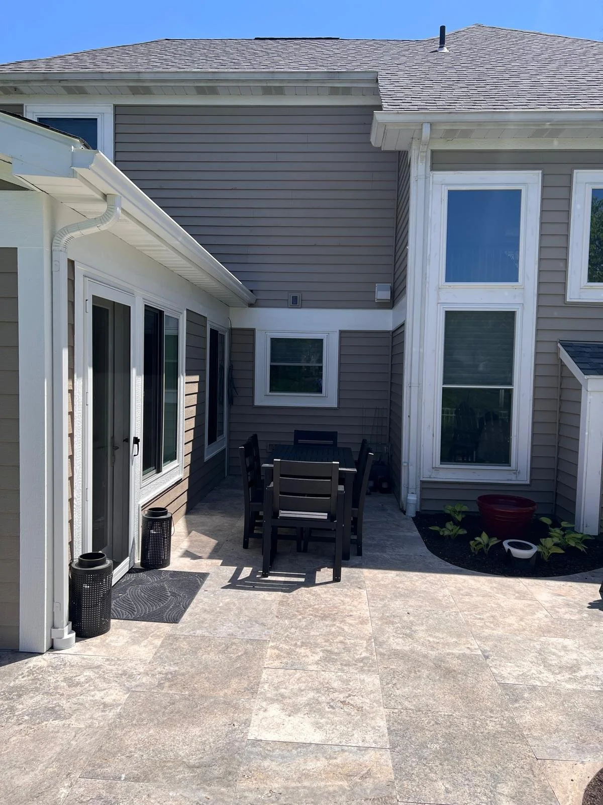 Backyard patio area behind a residential home before installation of a Solara patio cover