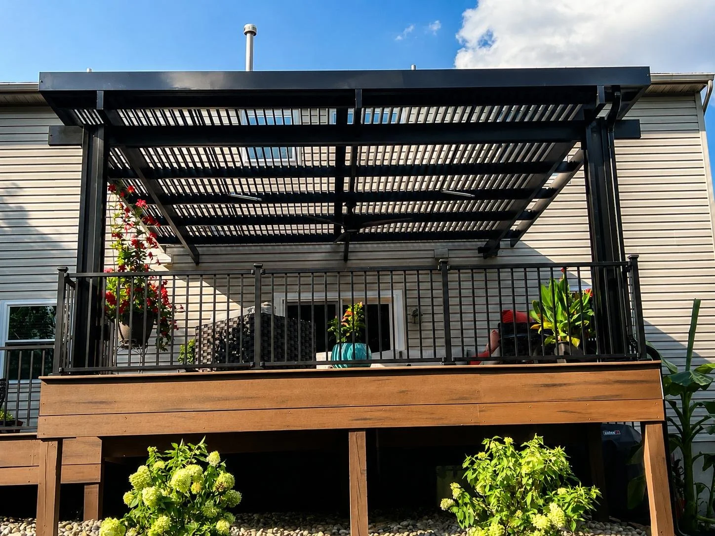 An outdoor space near a pool after installing Solara Patio Covers