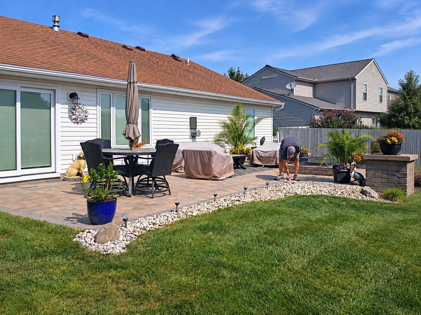 Backyard patio area behind a residential home before installation of a Solara patio cover