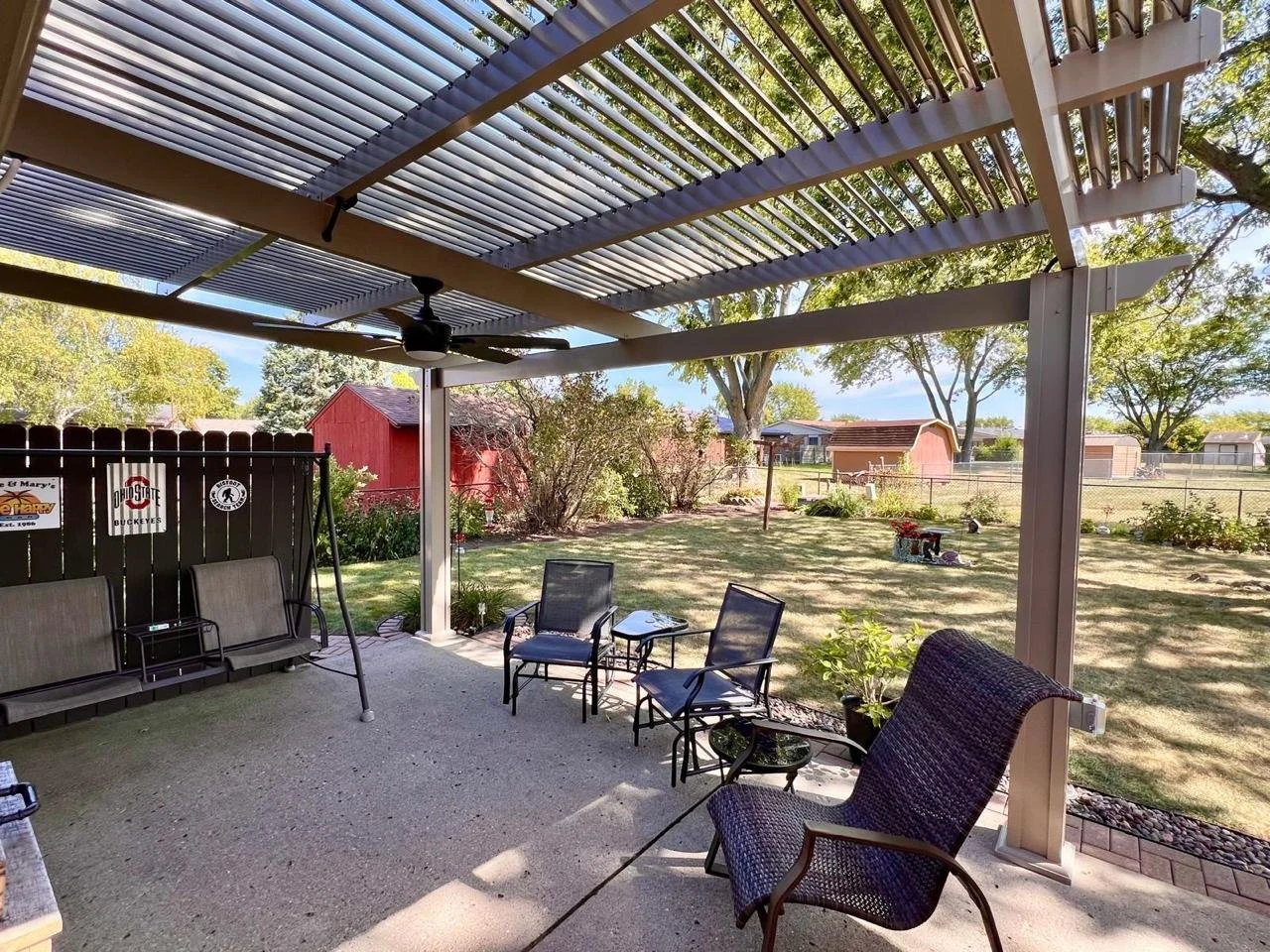 A patio cover with electrical attachments like a fan or light