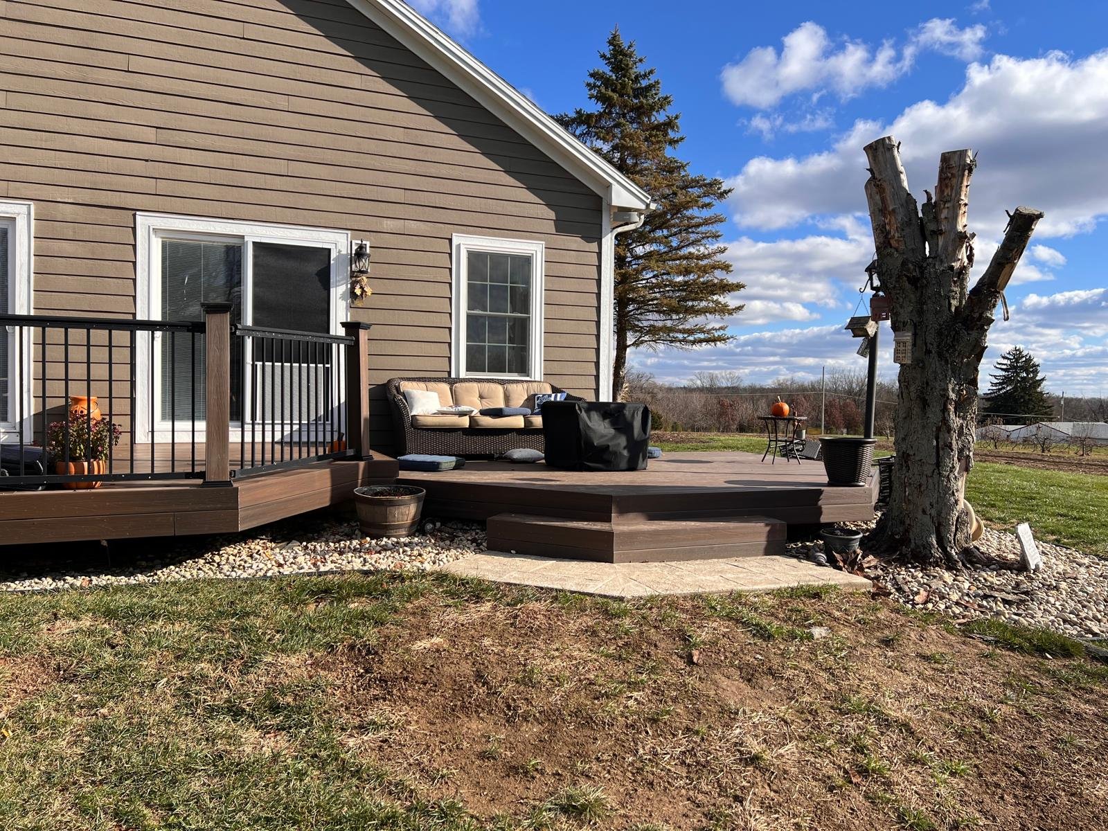 Backyard patio area behind a residential home before installation of a Solara patio cover