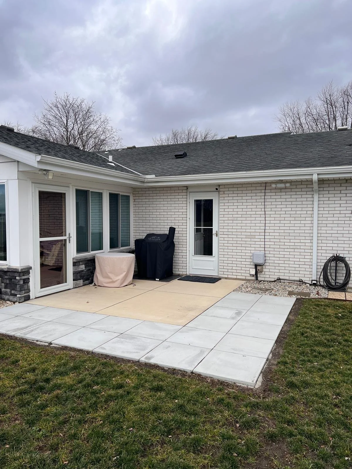 An outdoor space at a home before installing Solara Pergola Cover