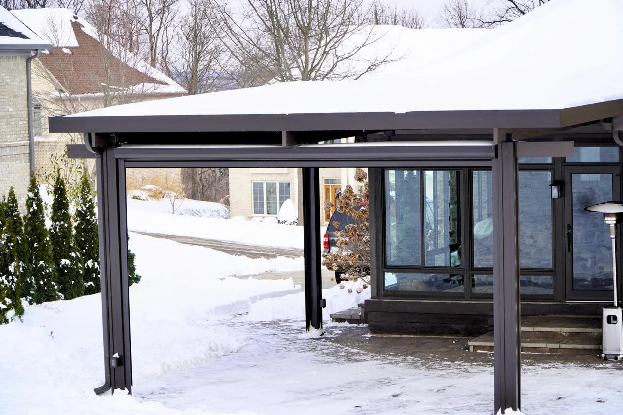 Patio cover supporting heavy snowfall in Ohio, demonstrating a structure designed to withstand regional weather conditions.