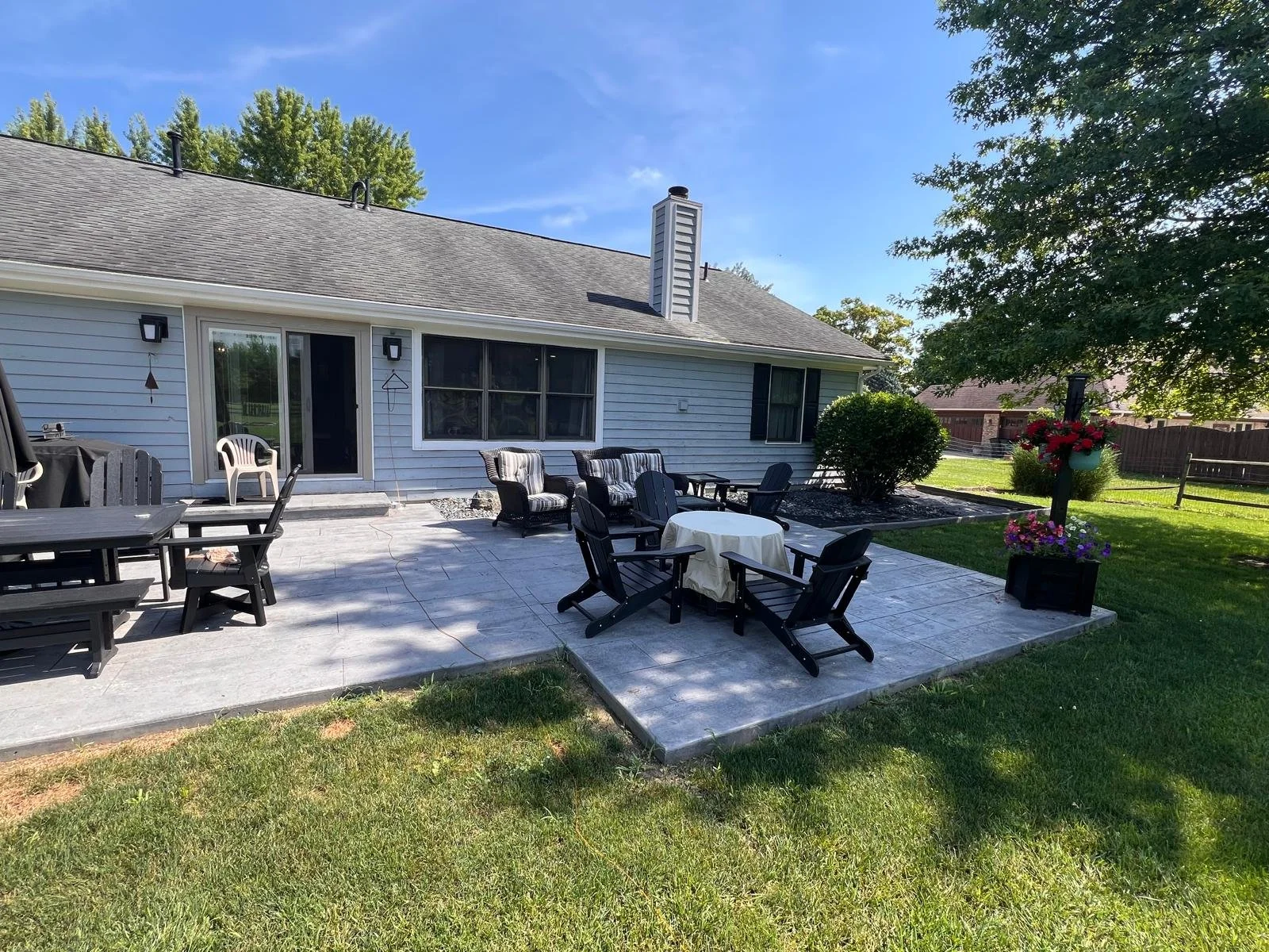 Backyard patio area behind a residential home before installation of a Solara patio cover