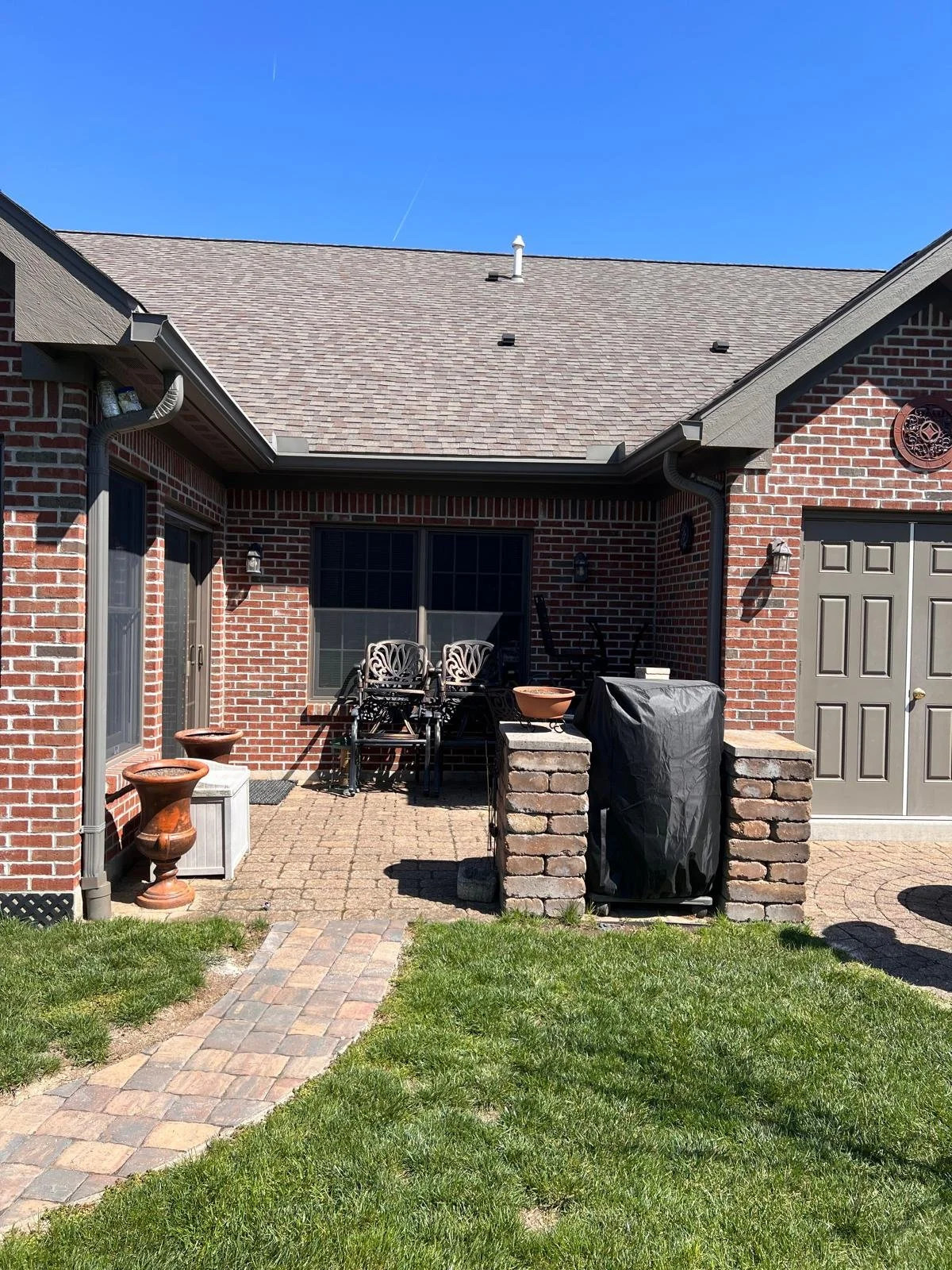 Backyard patio area behind a residential home before installation of a Solara patio cover