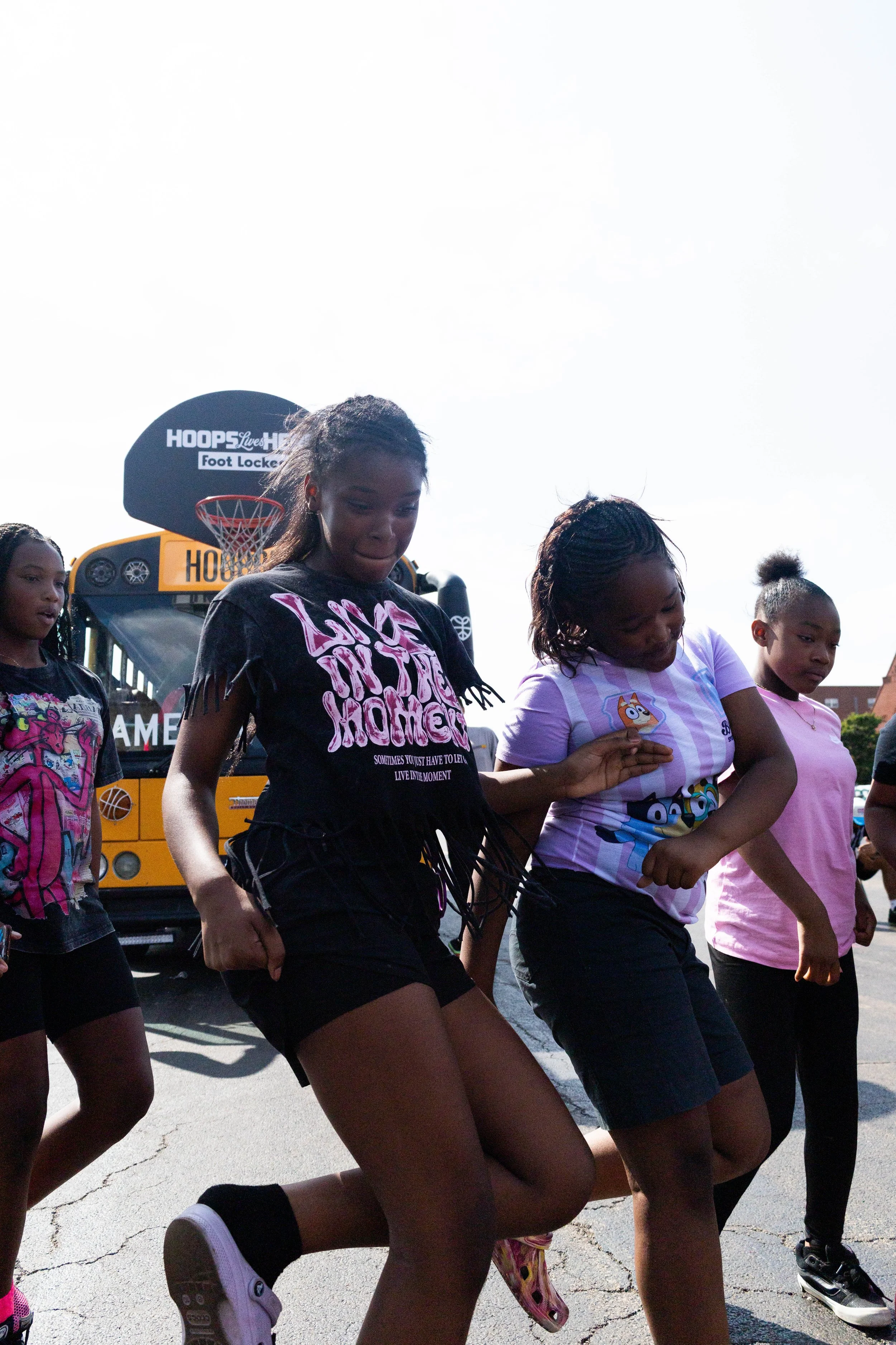  Youth dancing by the Hoopbus at United Center. 