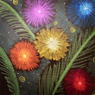 Colorful fireworks exploding in the night sky among green leaves.