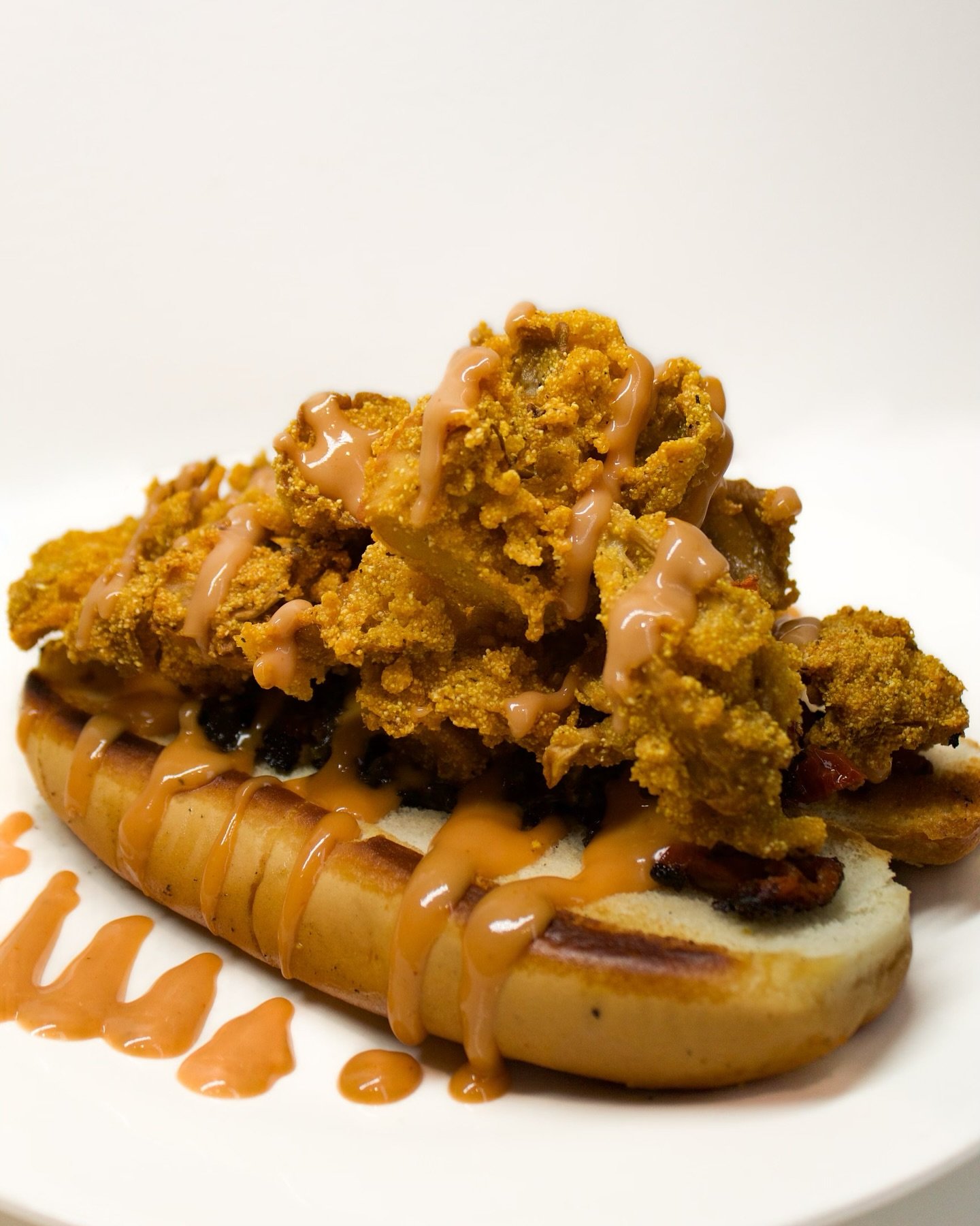 [ LOBSTER ROLL ]: No worries, there&rsquo;s no real lobster involved and none were harmed by us. Our signature Lobster Roll is made w/ Oyster Mushrooms! Fried in batter to give it a fish like taste, accompanied w/ saut&eacute;ed Kale and sun dried to
