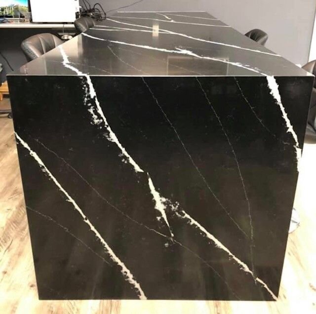 I love thinking about how many meetings will take place at this desk over the next few years. Certainly a centerpiece for our customer's office. Great work by the team with lining up the veining.