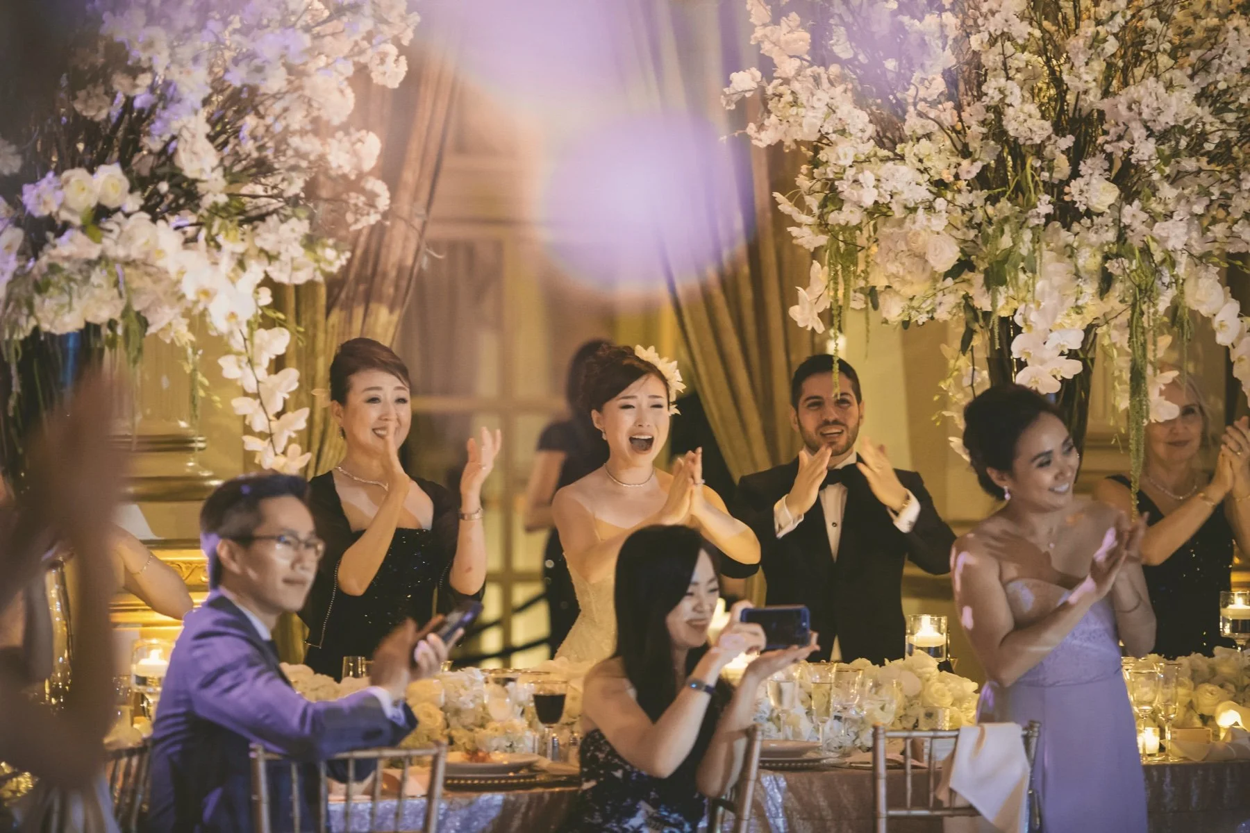 Guests smiling and applauding during a wedding celebration with SoundNJoy live music
