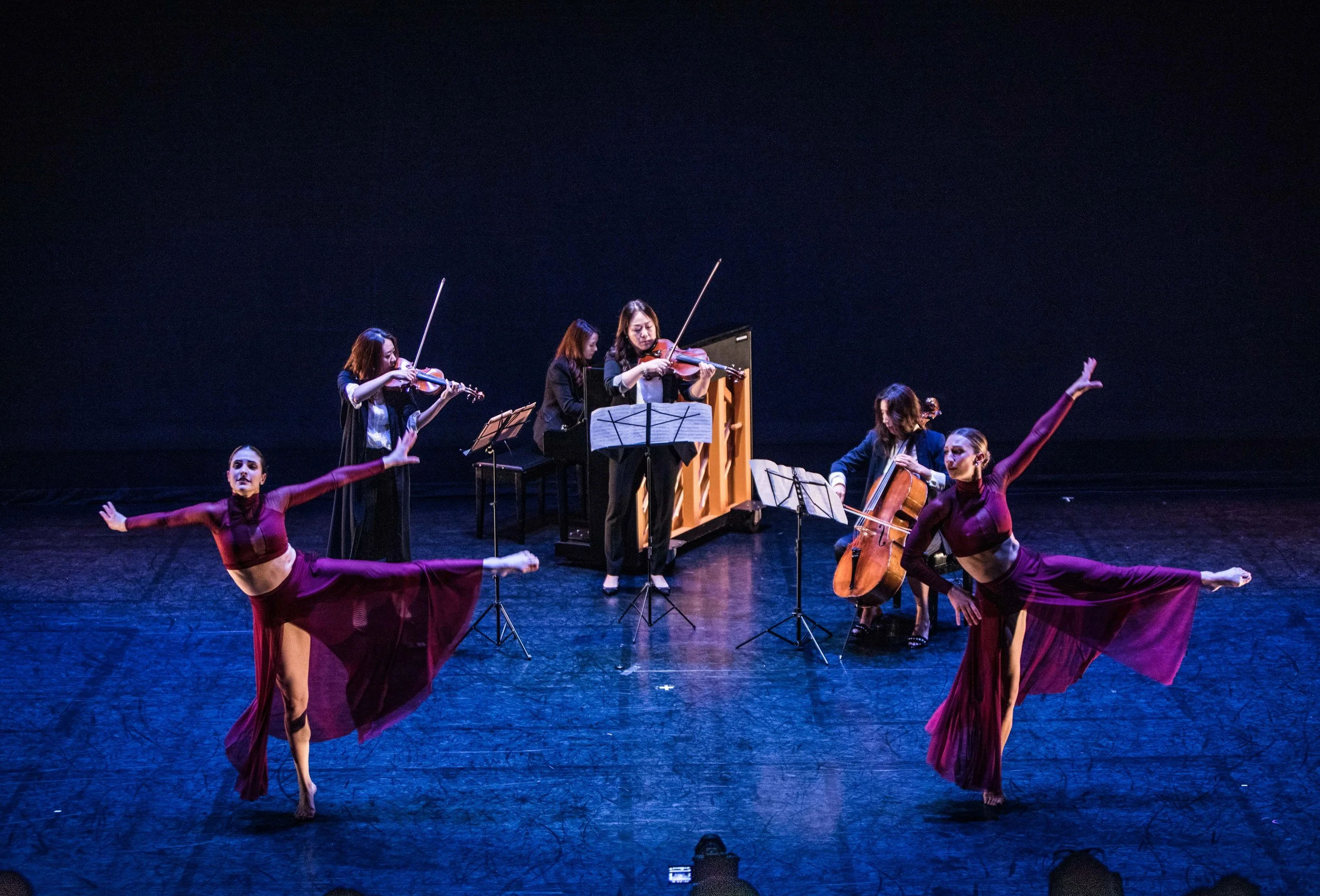 SoundNJoy violinists, cellist and pianist performing on stage with dancers