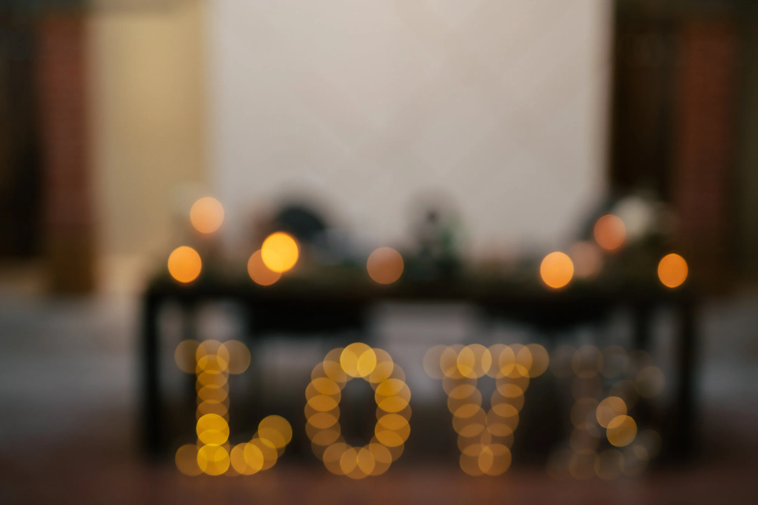 Blurred image with bokeh lights spelling 'LOVE'
