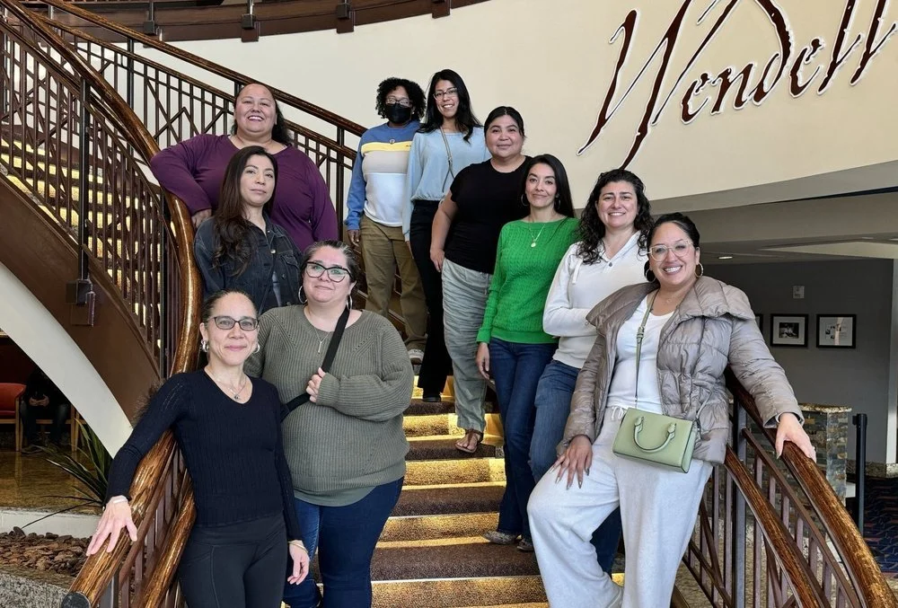 A Bold Futures staff lined up on a stairwell.