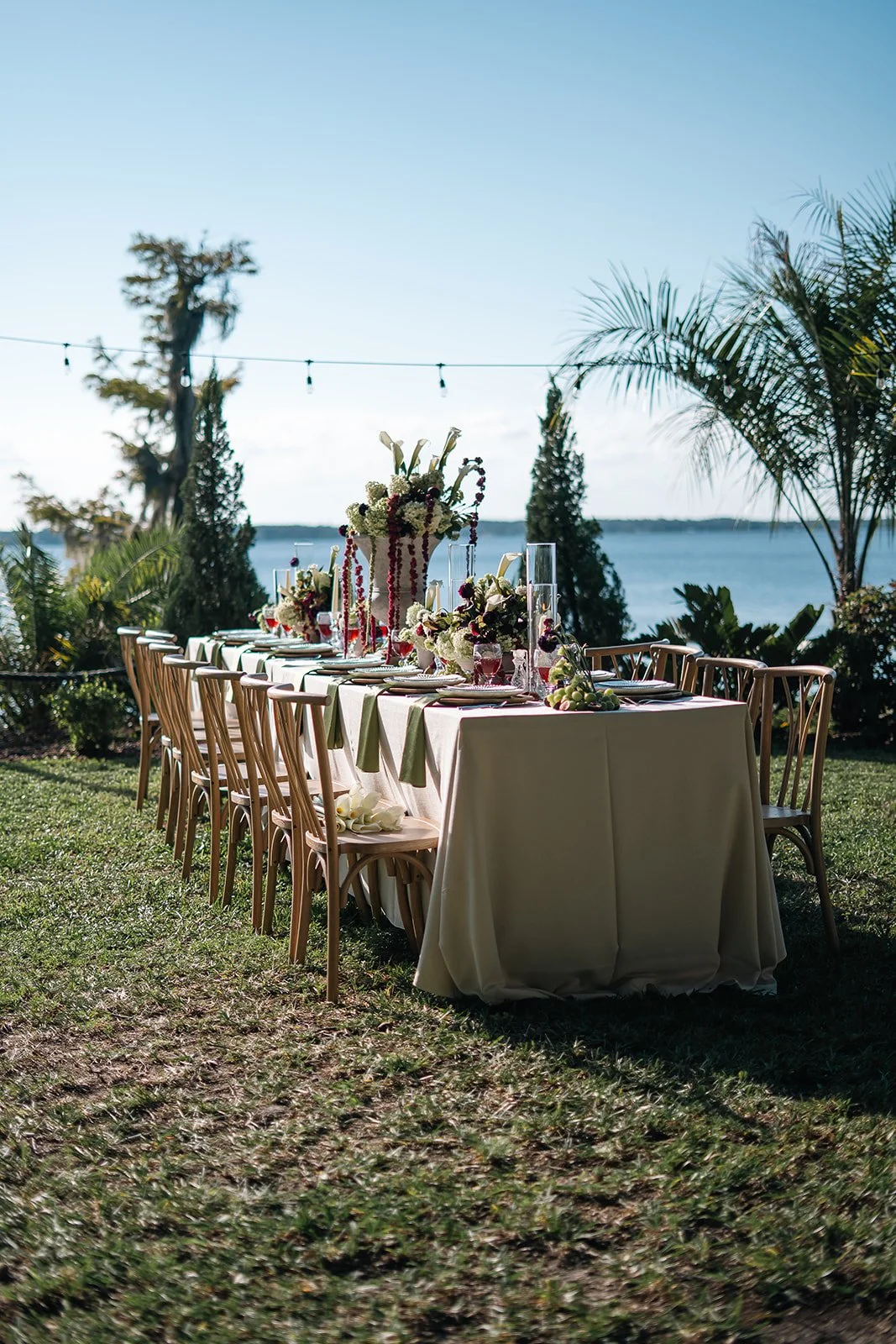 Minimalist micro wedding ceremony setup on a tropical coastline in Puerto Rico with simple florals and natural tones.