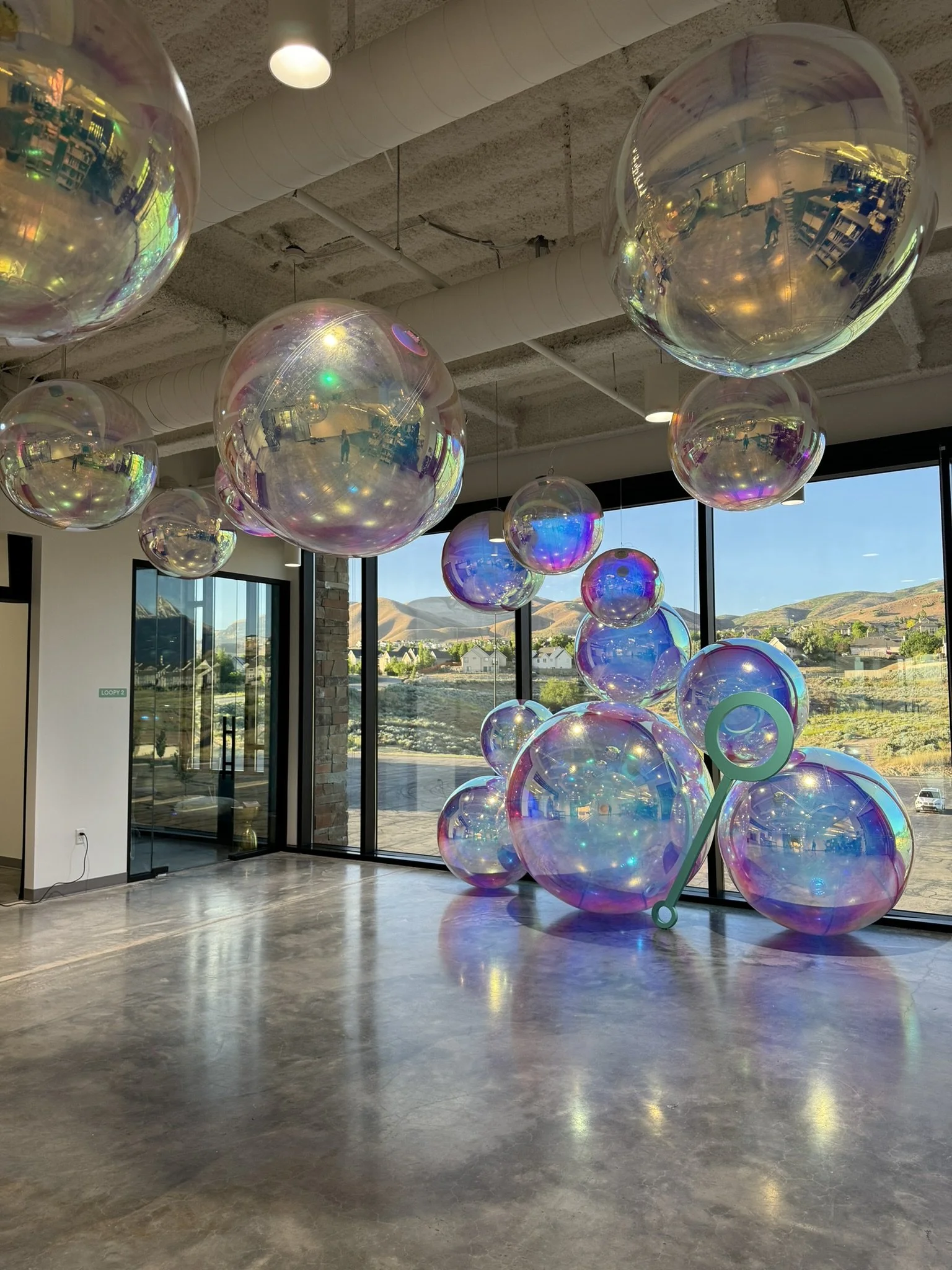Elevate Your Event with Our Metallic Globe Balloon Displays!