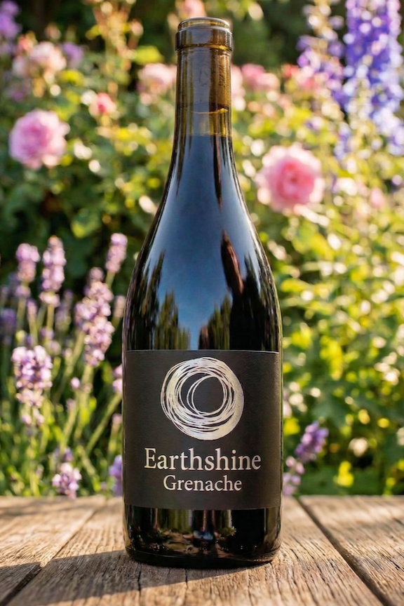 bottle of Earthshine grenache in flowers