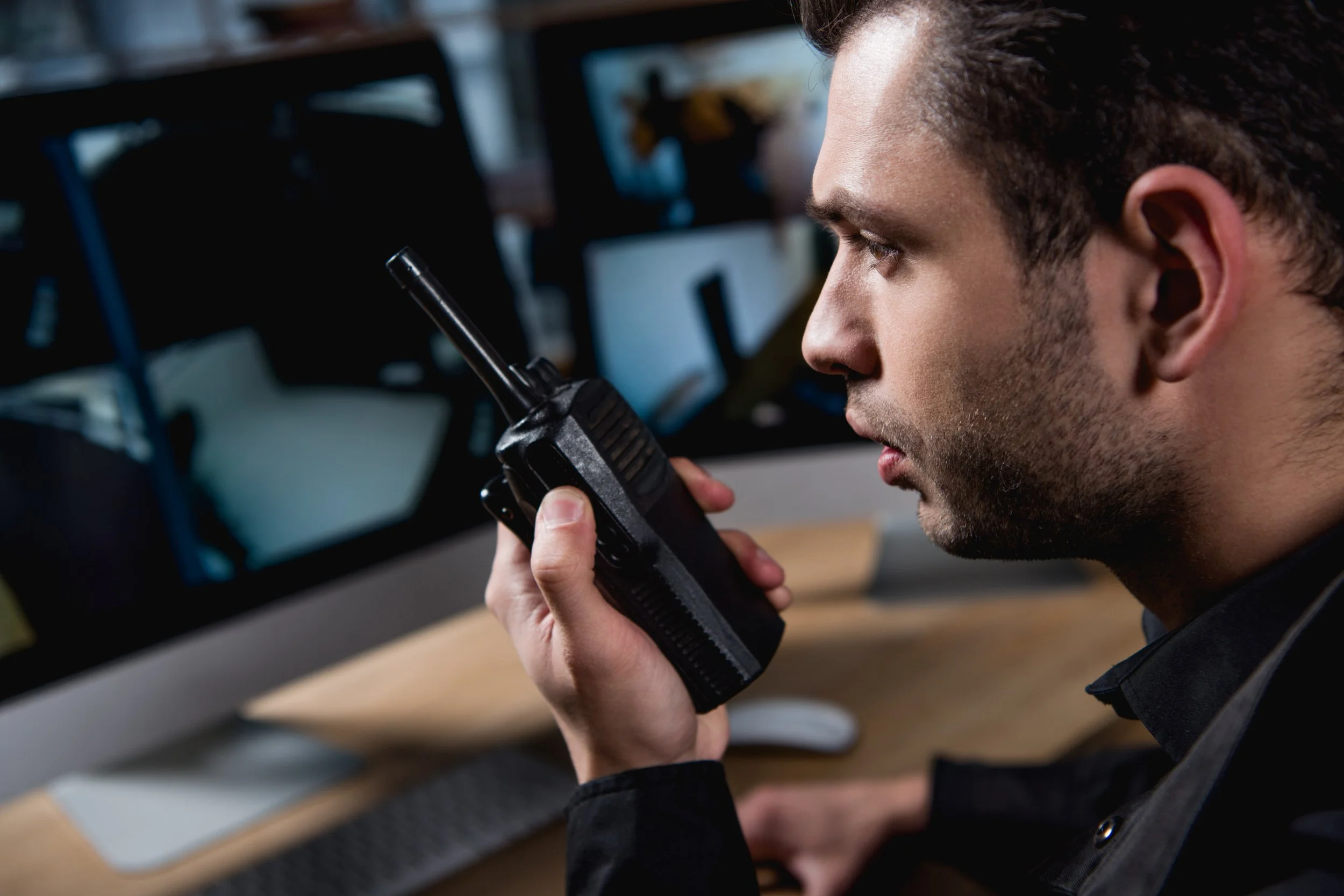 selective-focus-of-guard-holding-walkie-talkie-at-2021-09-03-07-13-49-utc.jpg