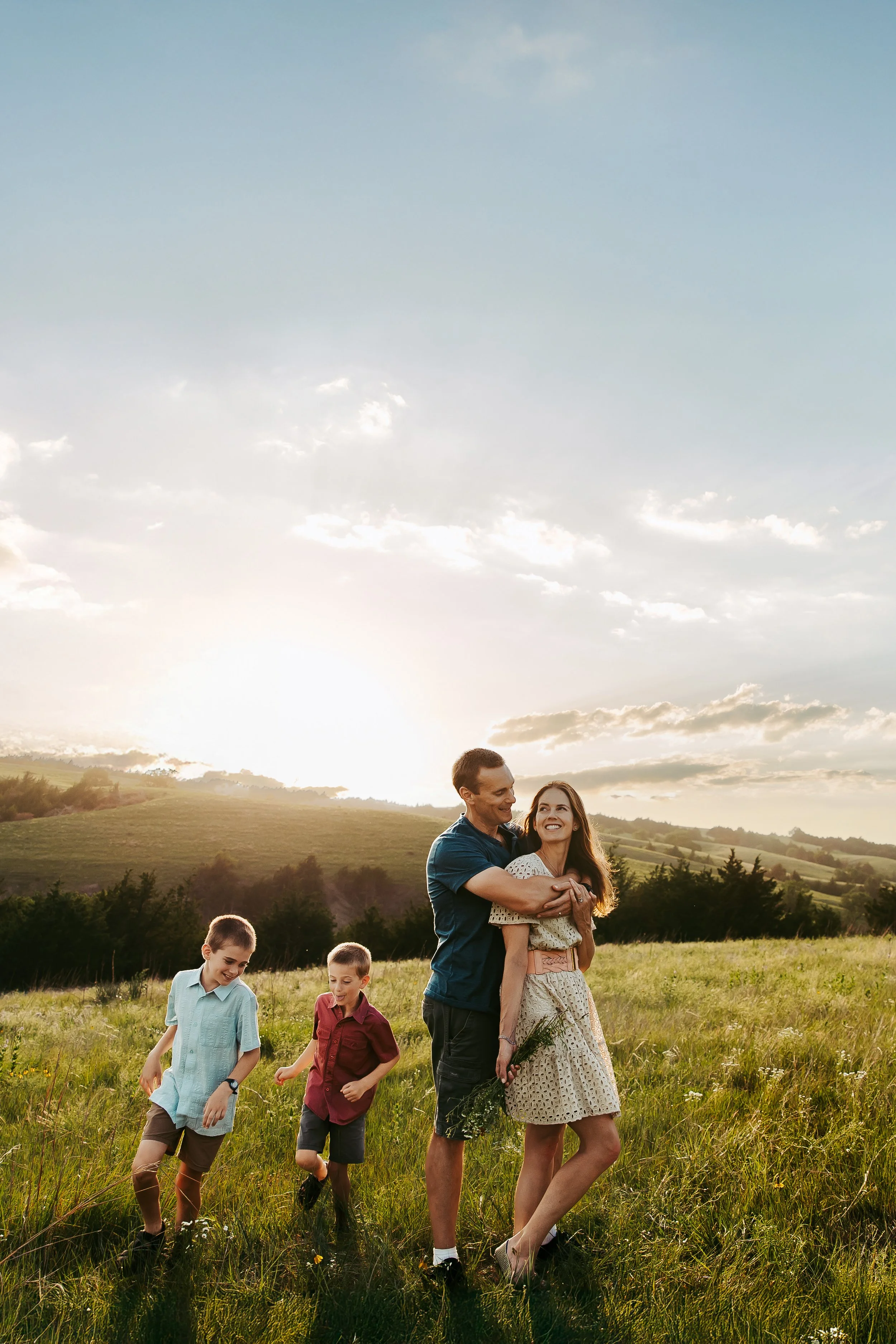 Children playing naturally during a family photography session captured in Nebraska