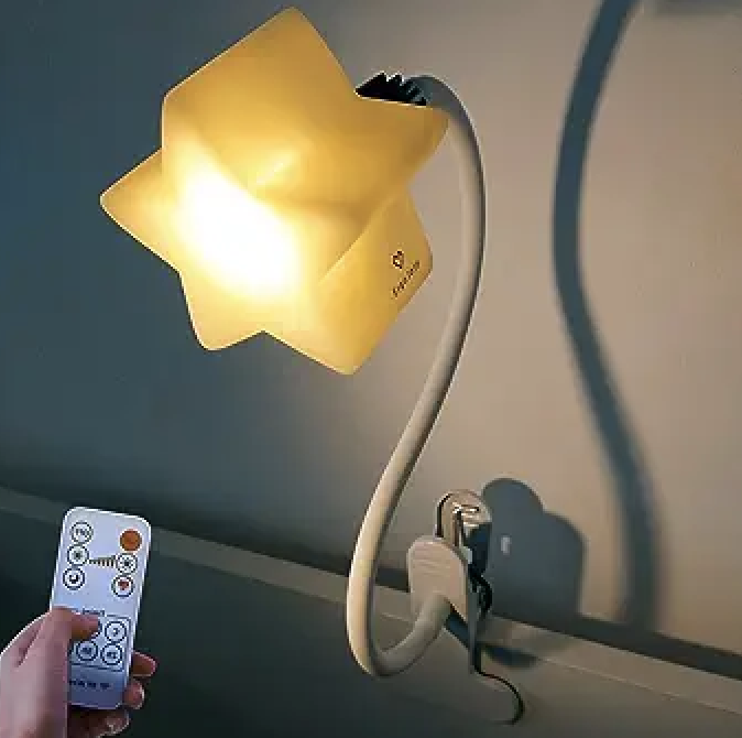 -- Clip on light -- Get this and clip it onto your changing table for nighttime changes. This way you don't have to turn the light on all the way and can instead have this soft light but still see what you're doing.