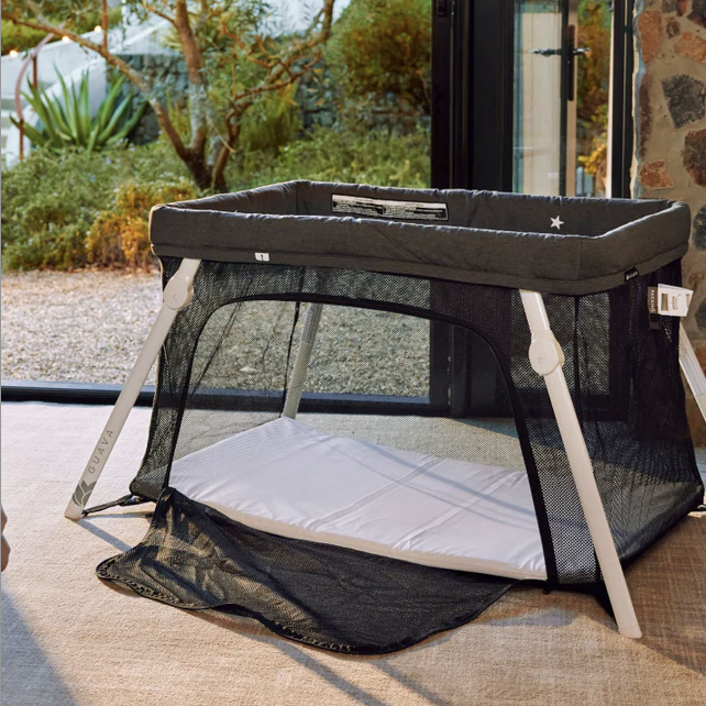 -- Lotus Travel Crib -- The most compact travel crib option. Folds up so easily and becomes really small. I also like that you attach the sheet to the mattress via clips making it stay snug even if baby moves around a lot.