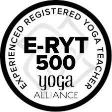 A circular logo for E-RYT 500 Yoga Alliance, indicating an experienced registered yoga teacher.