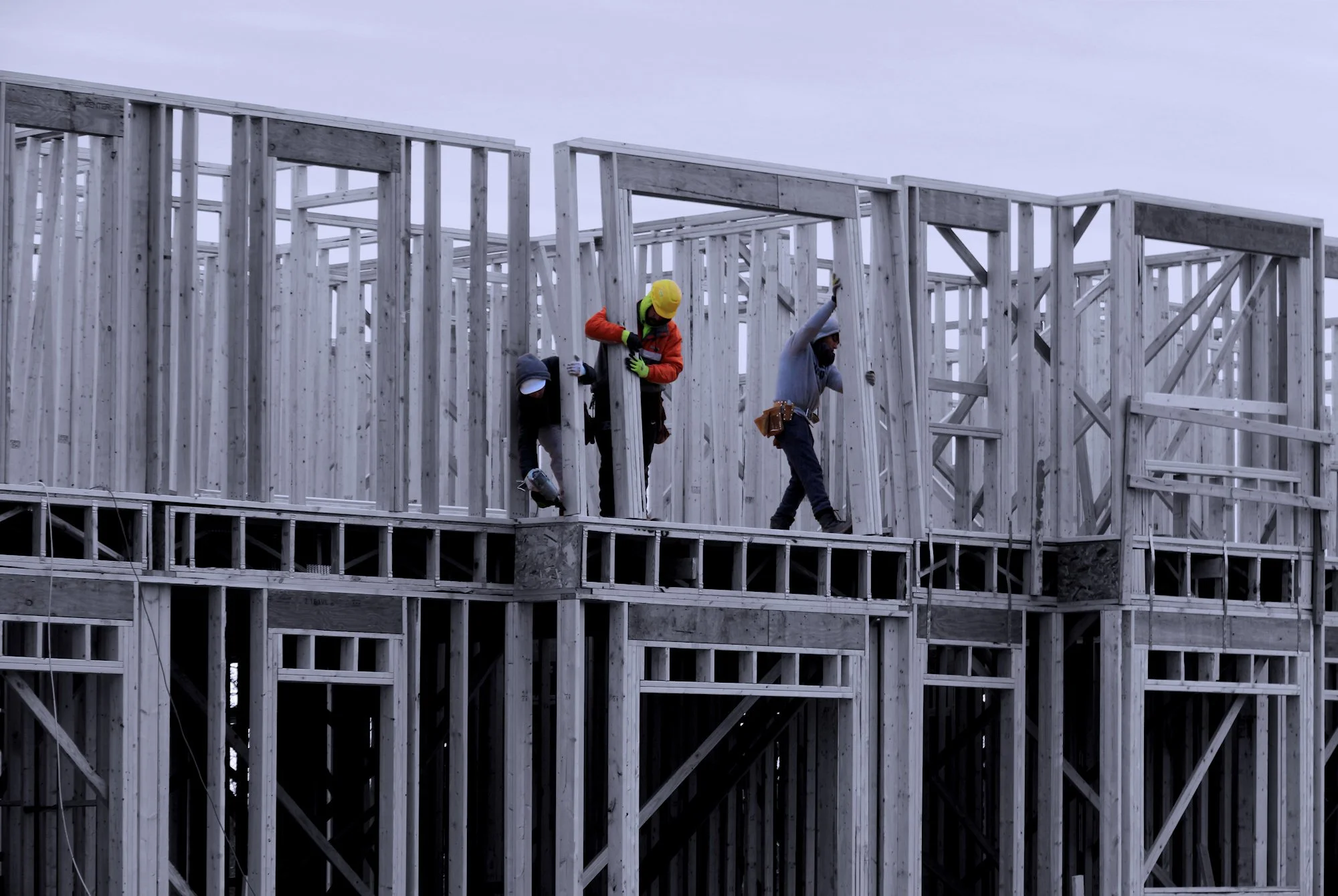210121.B.09.Y.01 - Carpenters Framing a New Exterior Wall