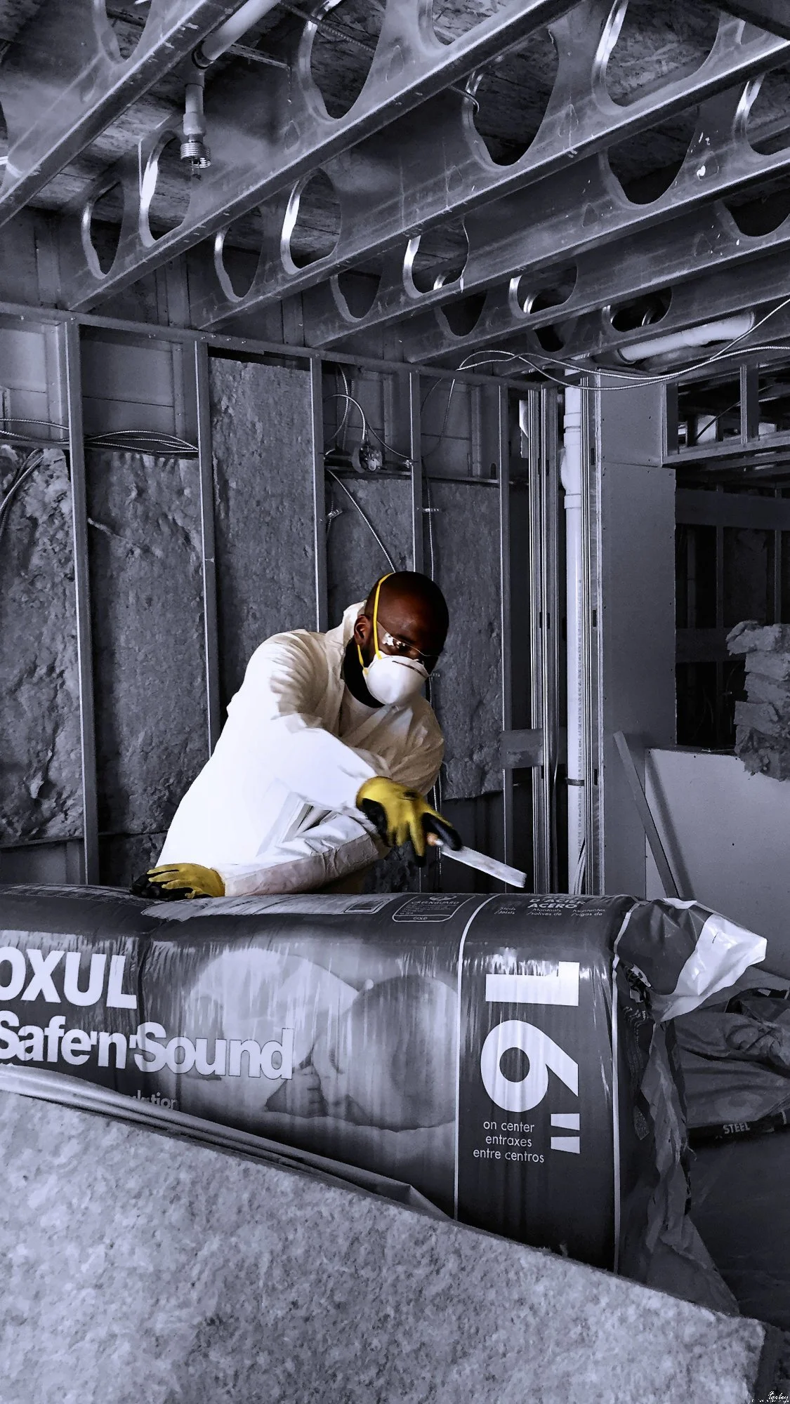 150723.A.03.Y.01 - Man Opening a Pack of Fiberglass Insulation