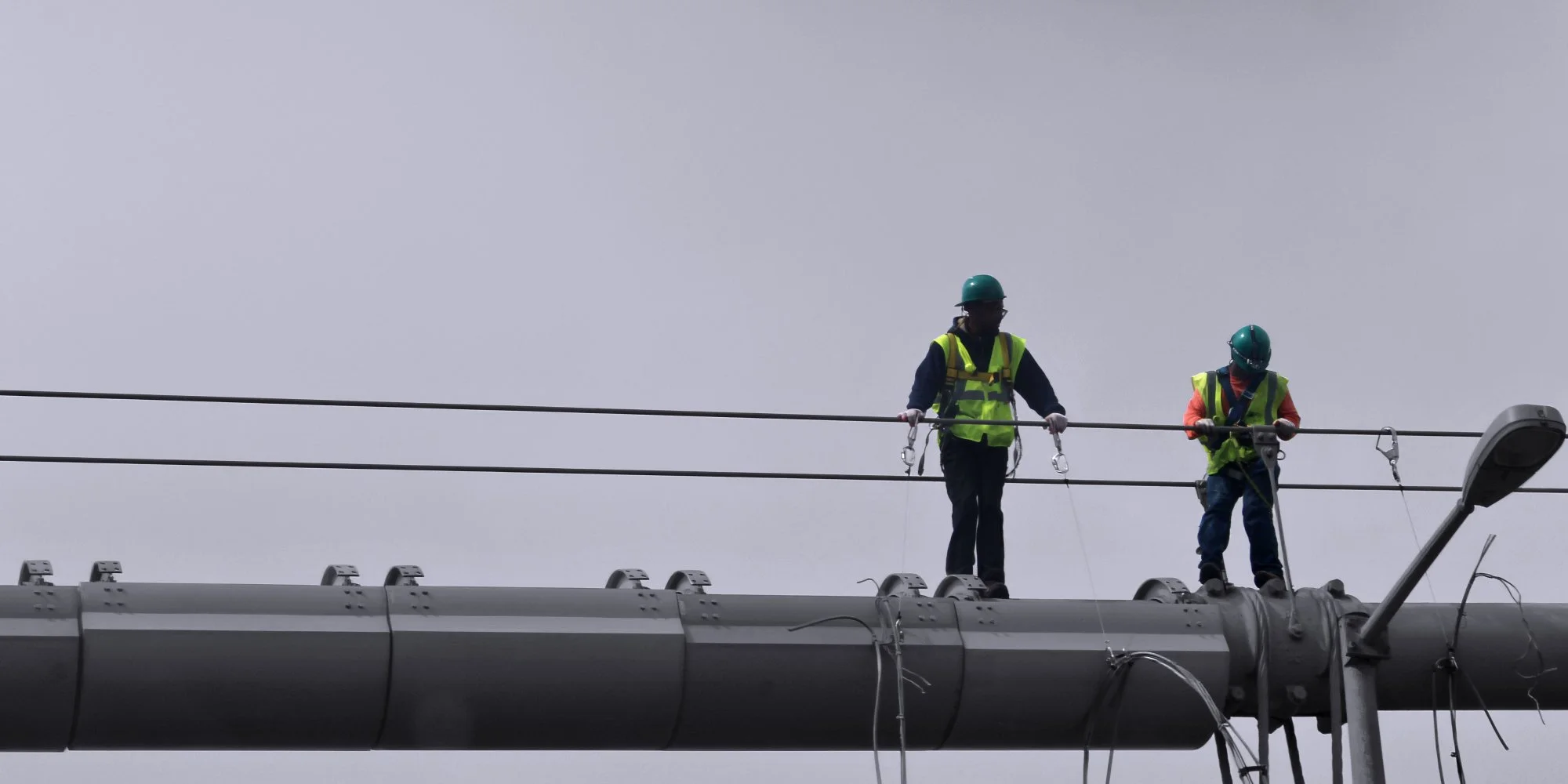 150928.A.19.Y.01 - Workers on the Cables of a Large Cable Suspension Bridge