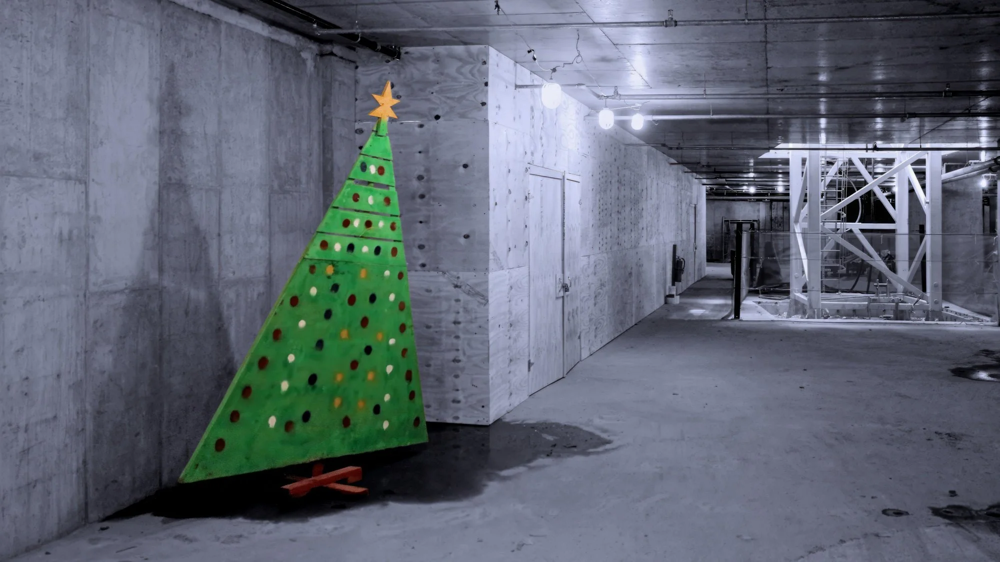 220422.A.03.N.01 - Plywood Christmas Tree and Base of a Tower Crane at a Construction Site
