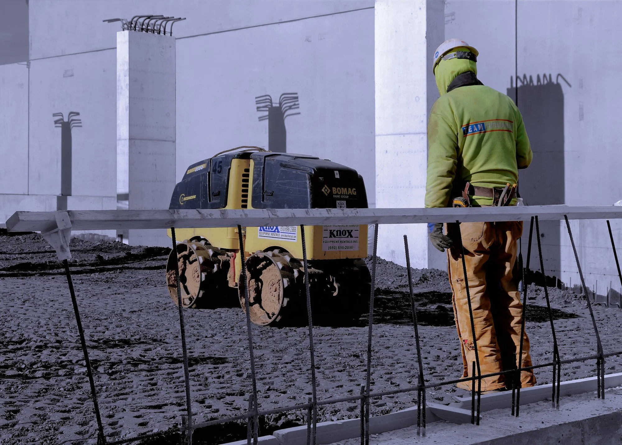 Building construction site scope earth soil compaction B&W color photojournalism