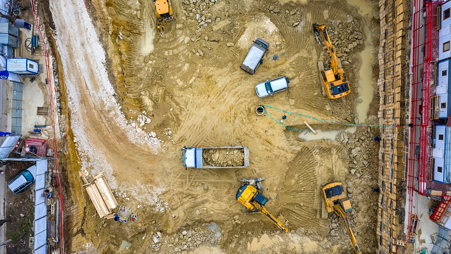 Aerial view of a construction site with heavy equipment operating.