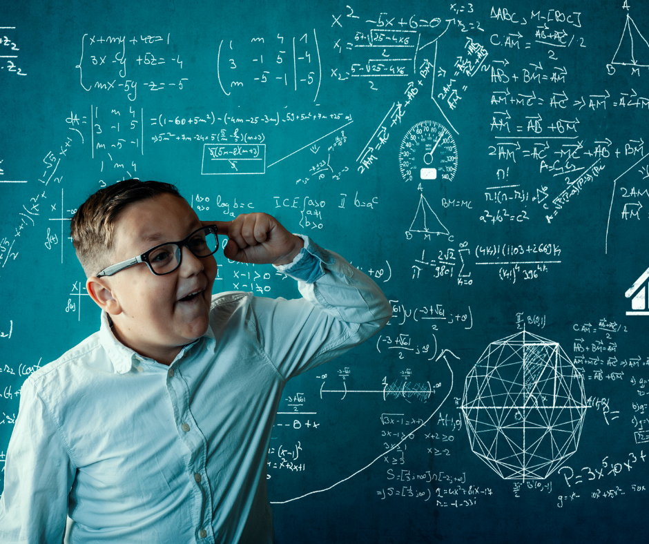 student in front of a chalk board with math problems