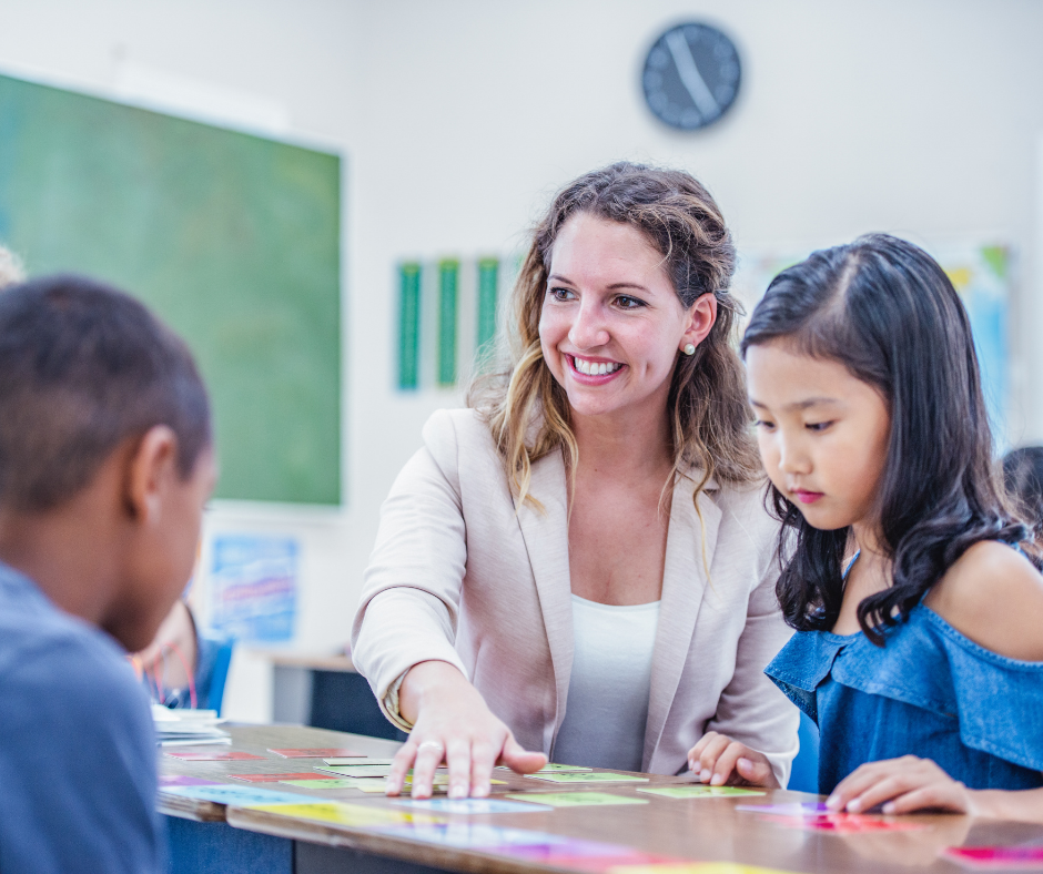 teacher smiling with students