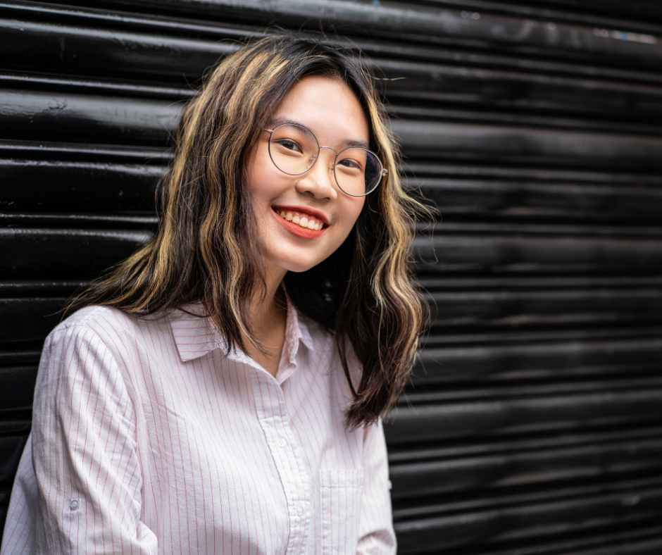 college aged girl smiling into camera