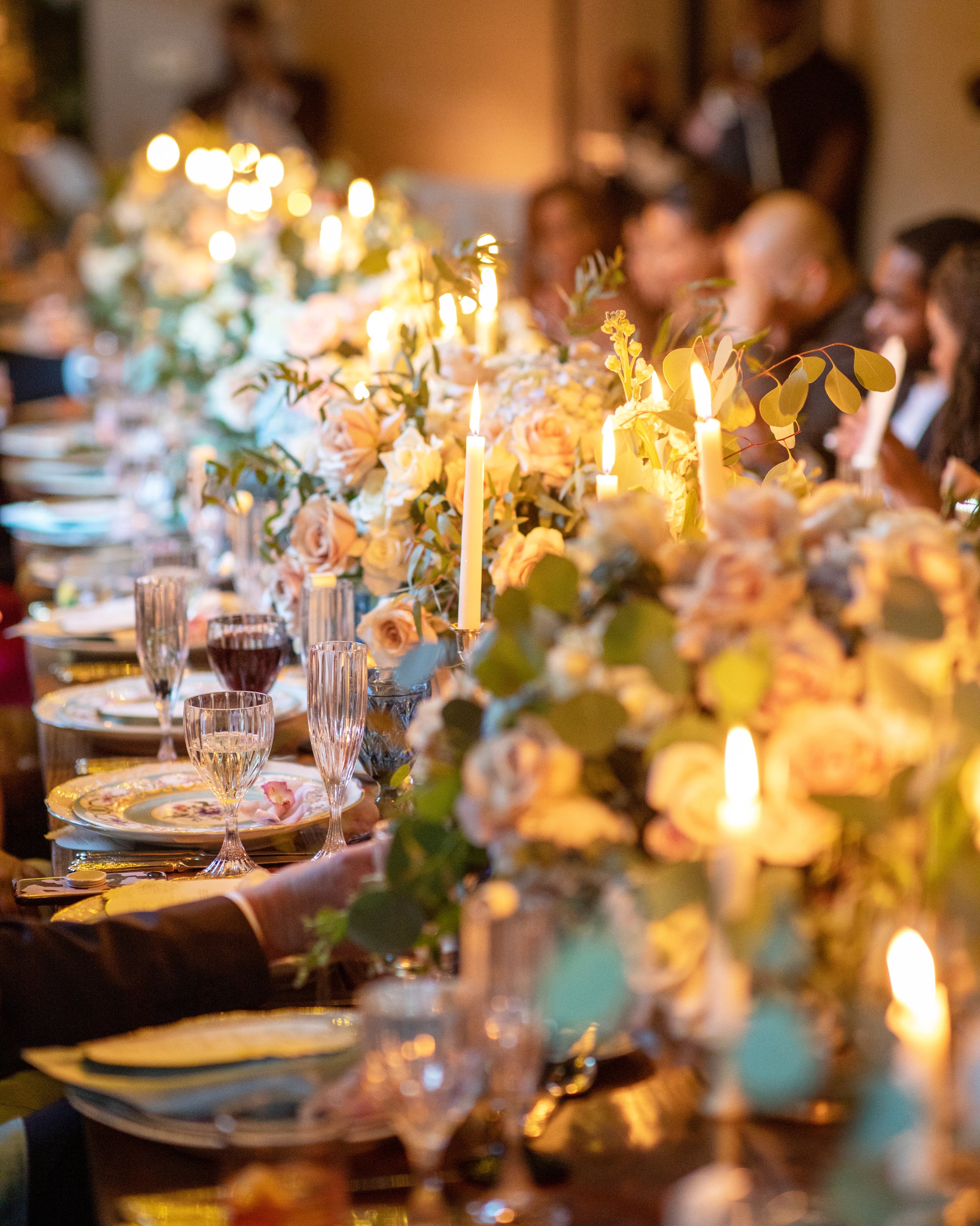 the art of celebrating - Panoramic view of an elegantly set dining table with a sophisticated tablescape, featuring fine china, crystal glassware, and a floral centerpiece, ready for a luxurious gathering..JPG