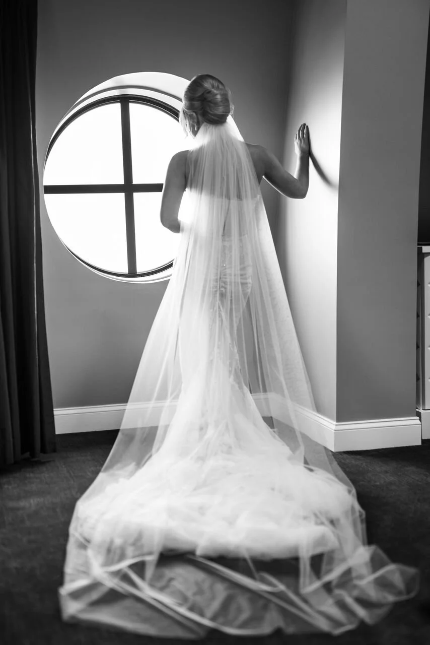 The bride in her stunning white wedding dress, standing out as the centerpiece of the celebration.