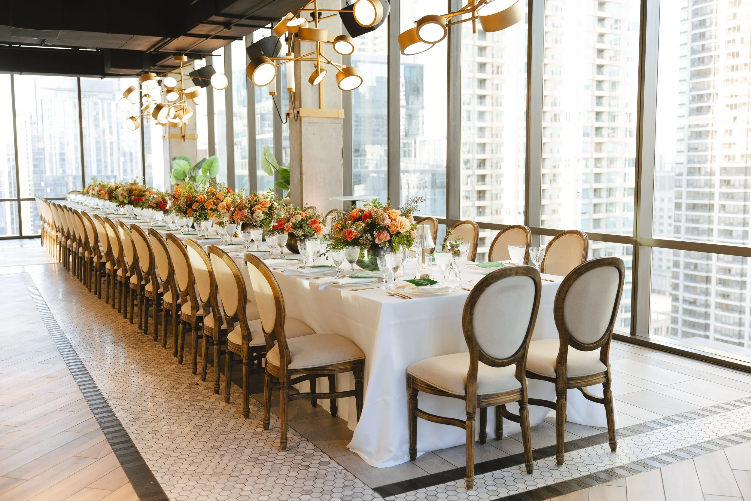 High-end wedding reception featuring custom floral design, elegant tablescapes and atmospheric lighting by Kesh Events.