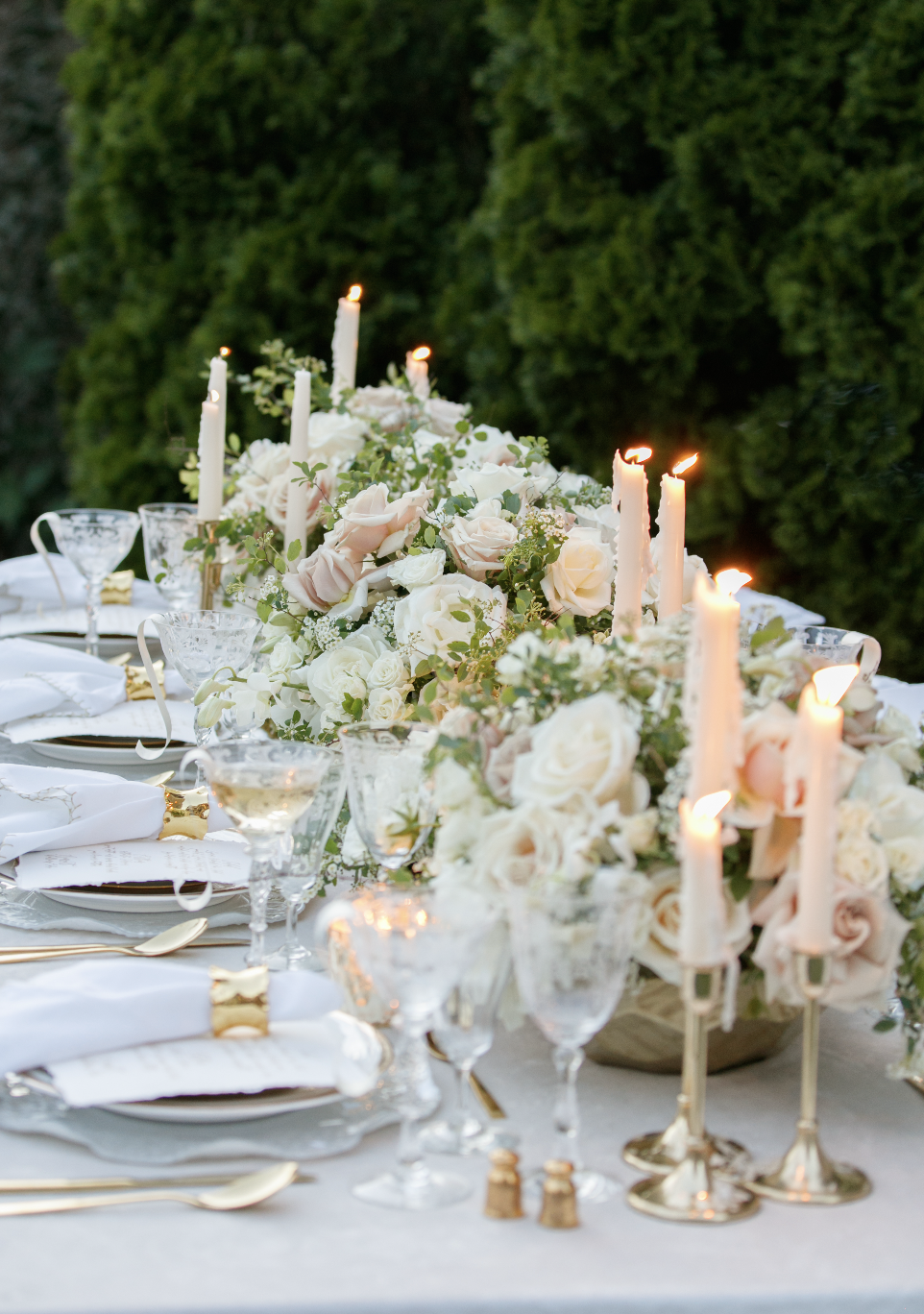 Elegant tablescape with layered linens and floral centerpiece