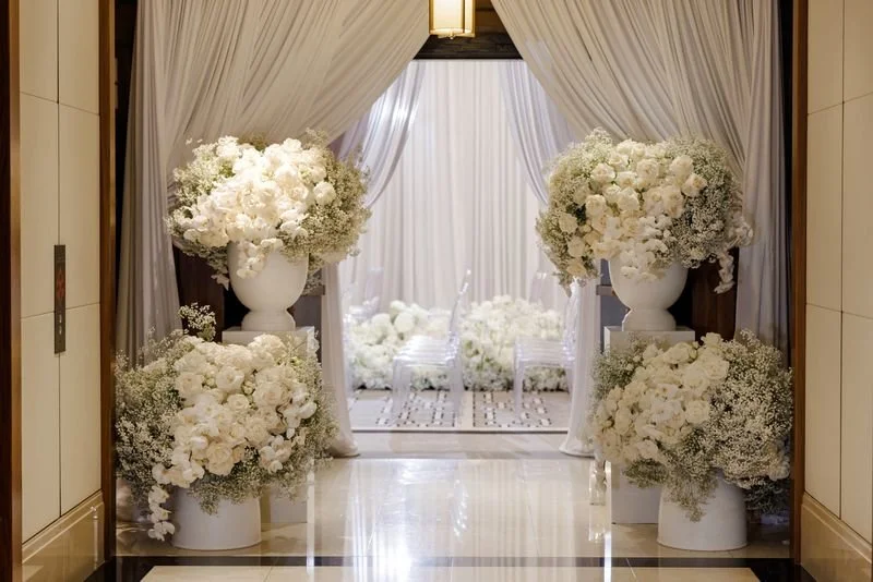 Large-scale wedding reception installation with custom lighting, florals and tablescape design.