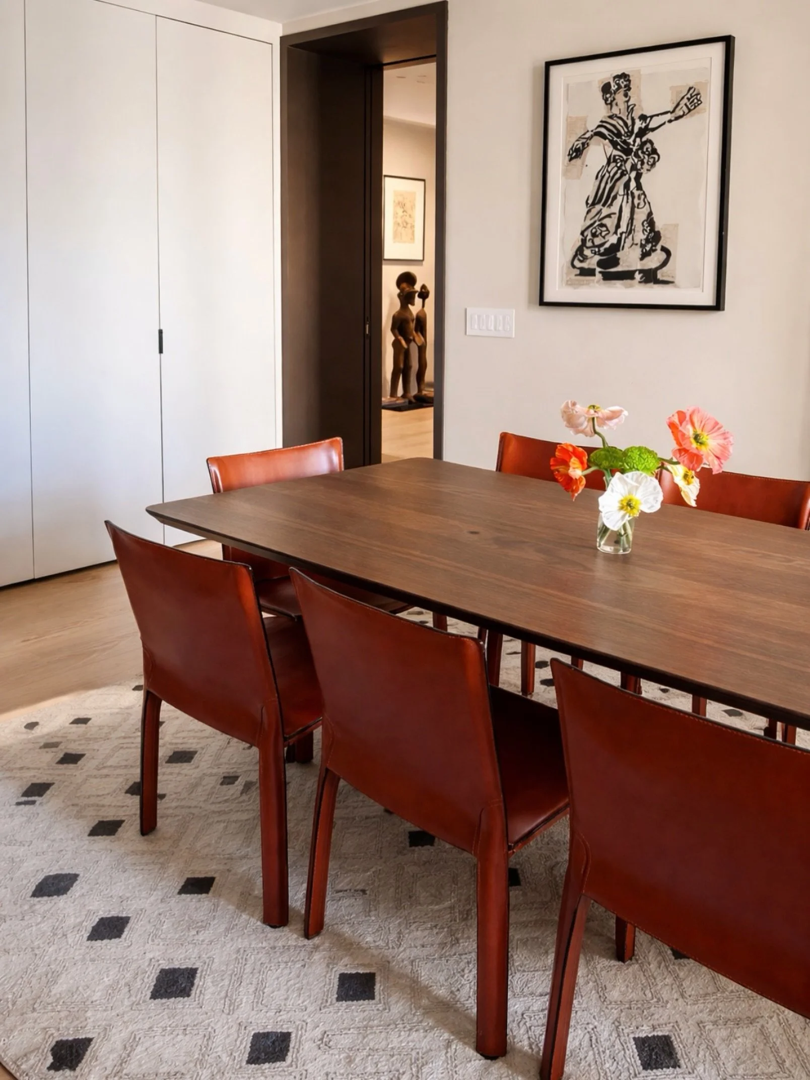Dining room details at our Central Park West project

Cab 412 dining chairs by Mario Bellini for Cassina, Italy circa 1970&rsquo;s, William Kentridge single color lithograph and collage, custom walnut dining table