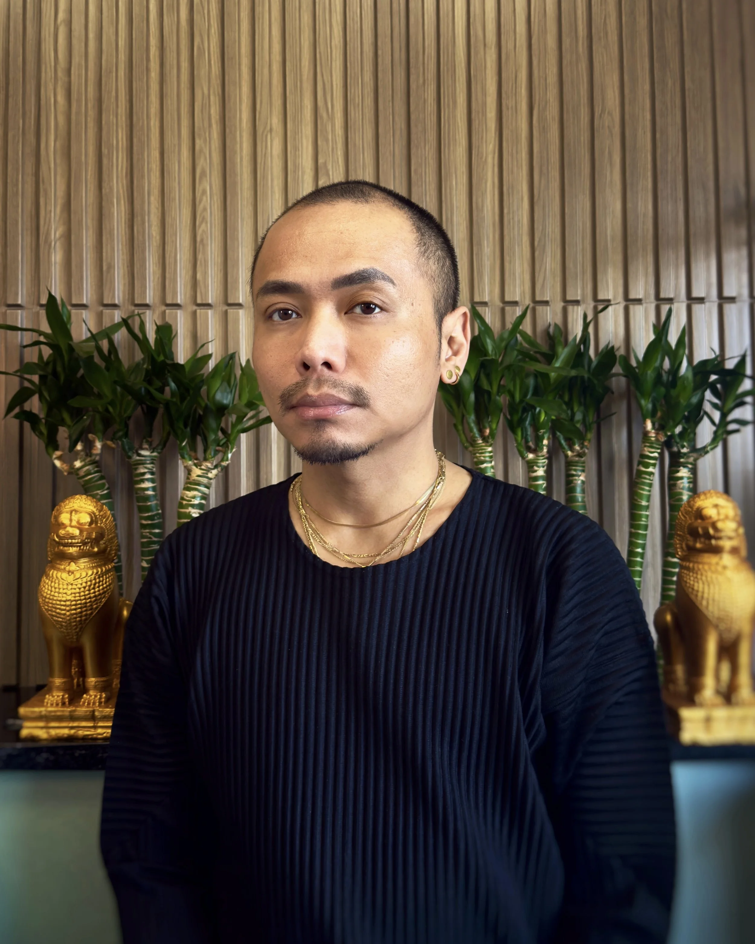 David Chum portrait in his studio